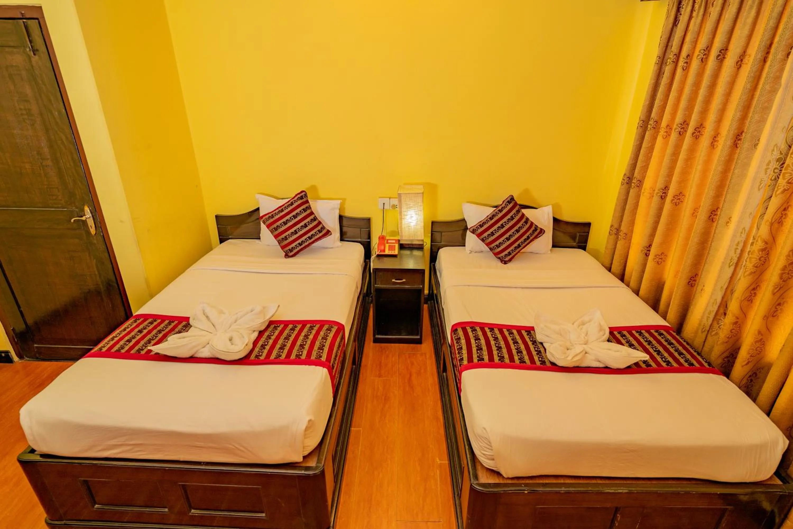 Bed in Hotel Bougainvillea