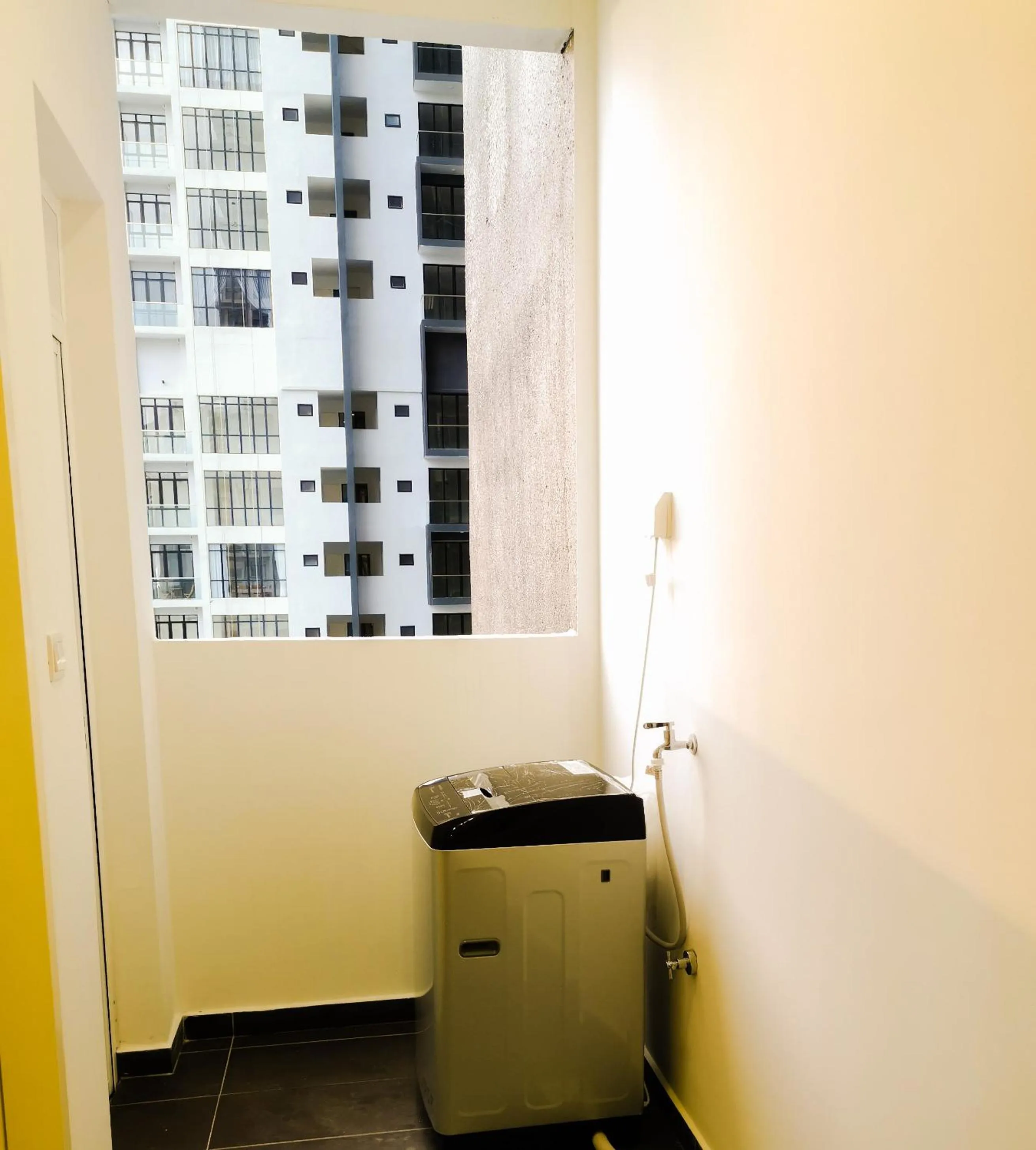 washing machine in Legoland D'PRISTINE Apartment By TGP