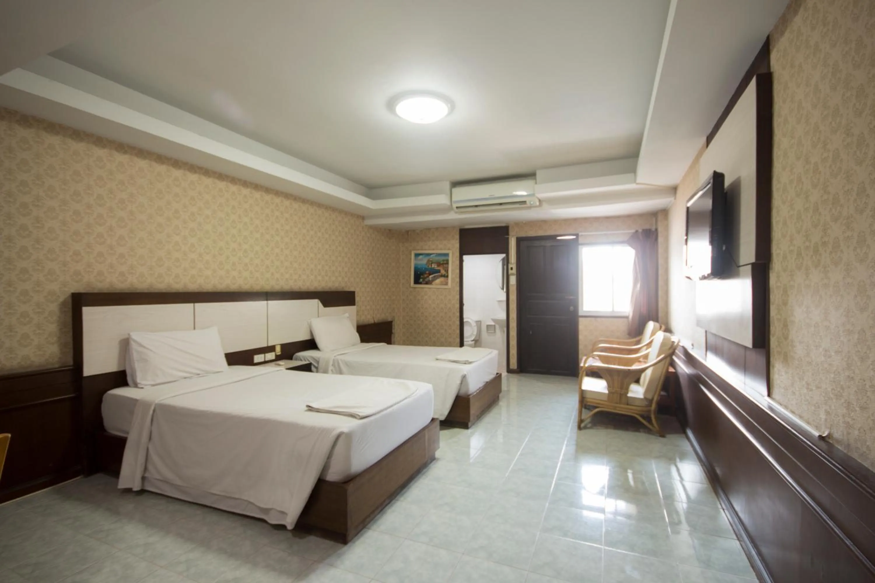 Photo of the whole room, Bed in Khon Kaen Ruenrom Hotel