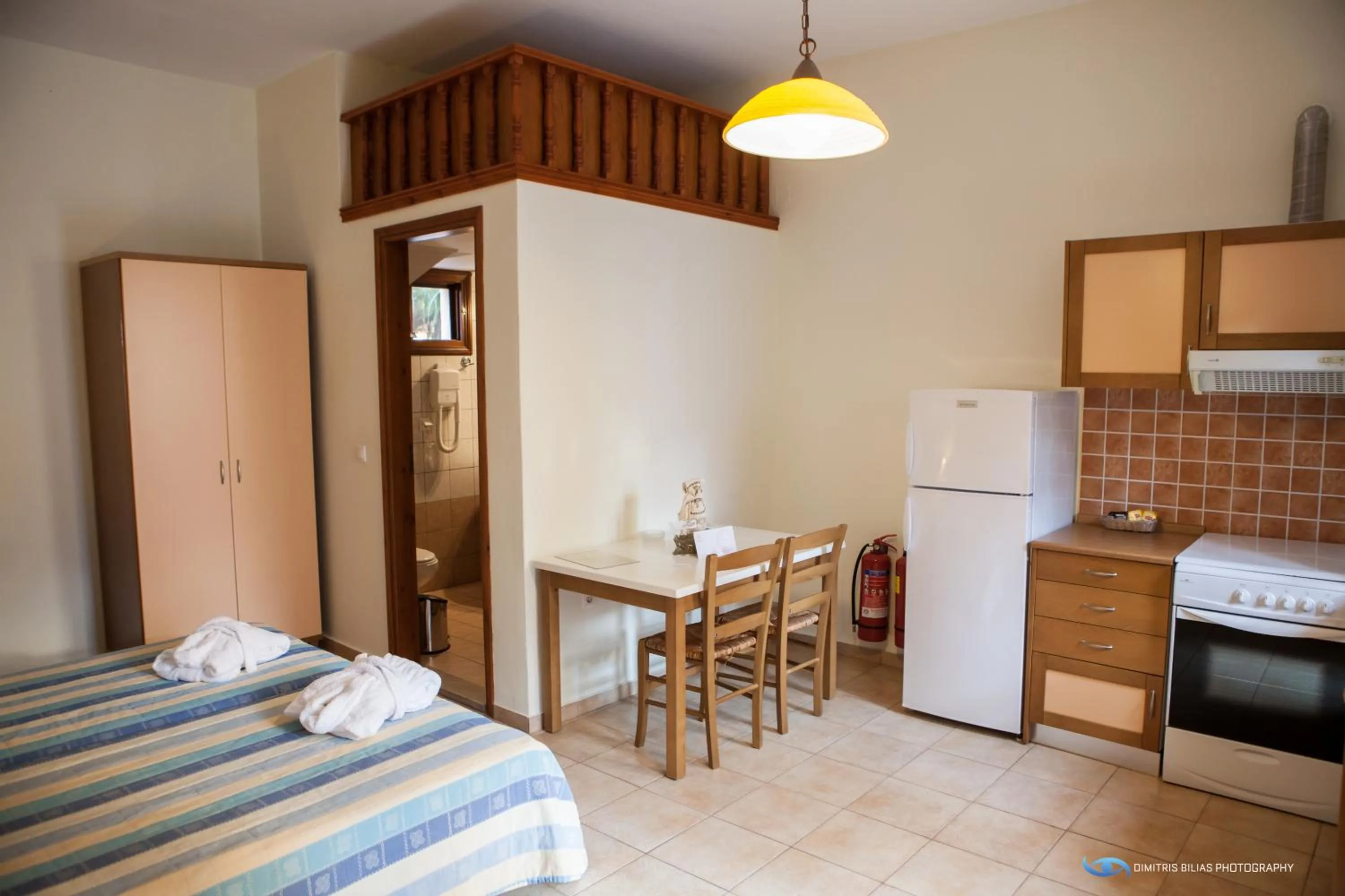 Dining area, Bed in Iapetos Village