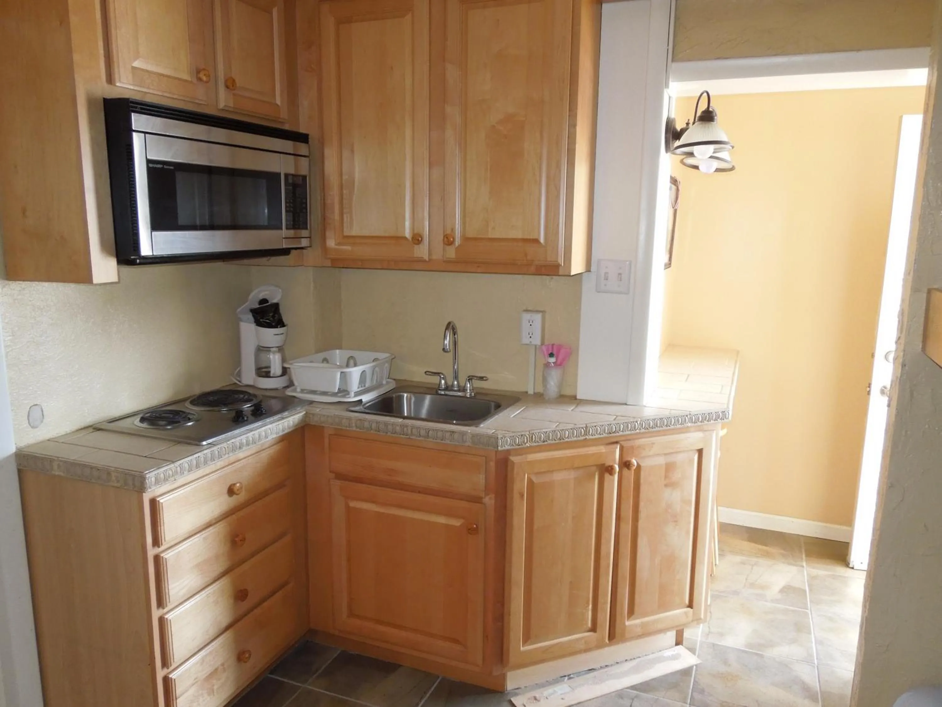 Kitchen or kitchenette in Sifting Sands Motel