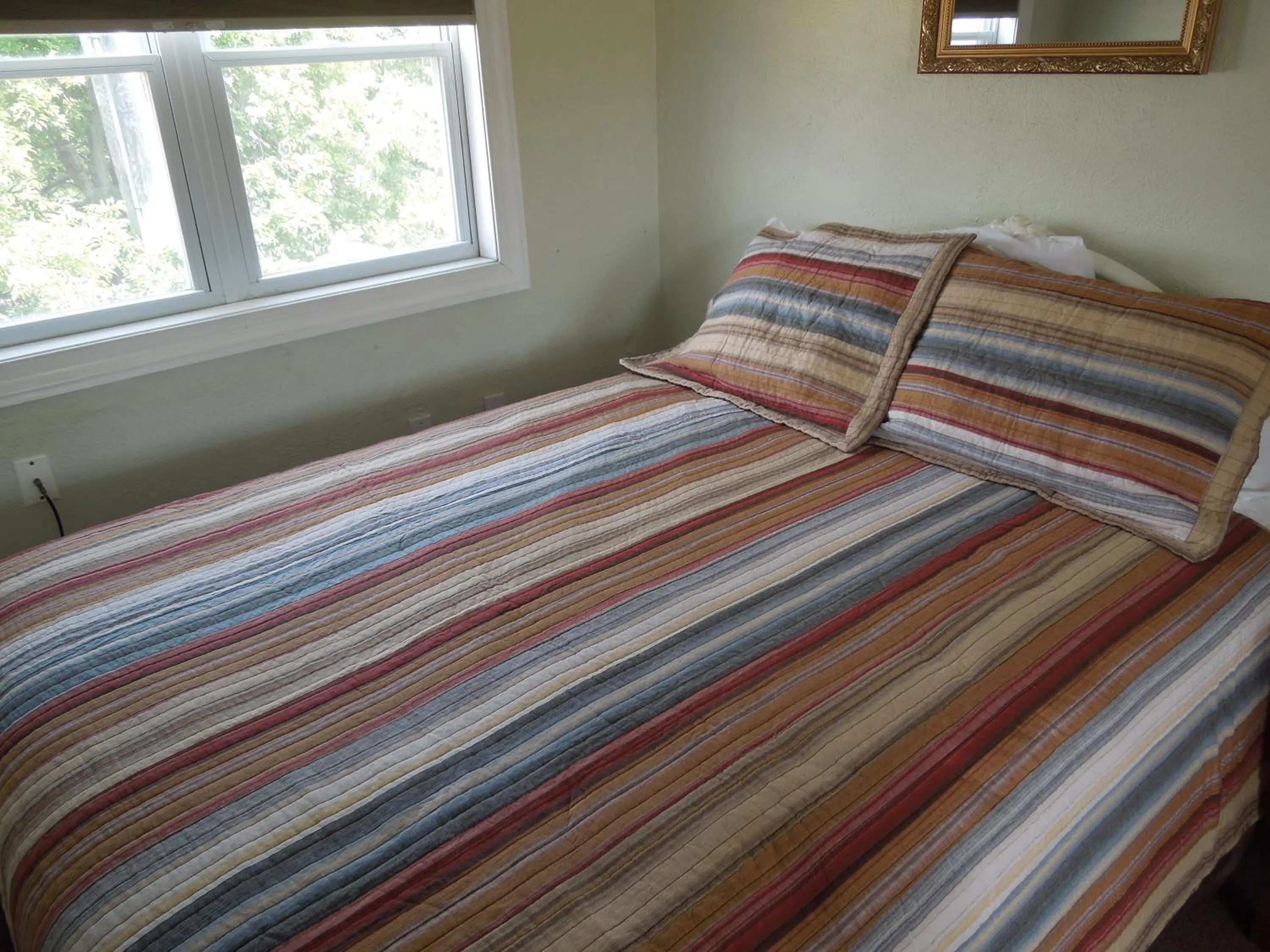 Bed in Sifting Sands Motel