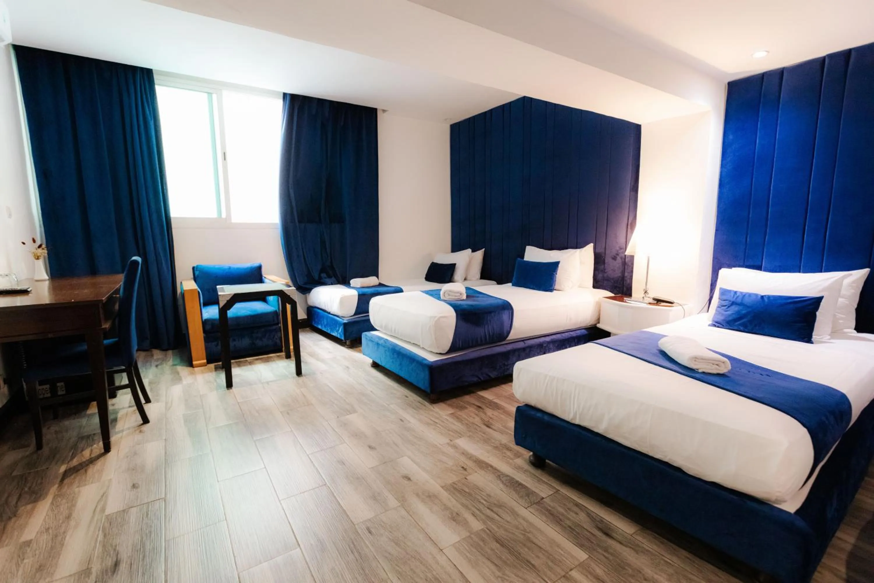 Bed in WINDSOR HOTEL CITY CENTER