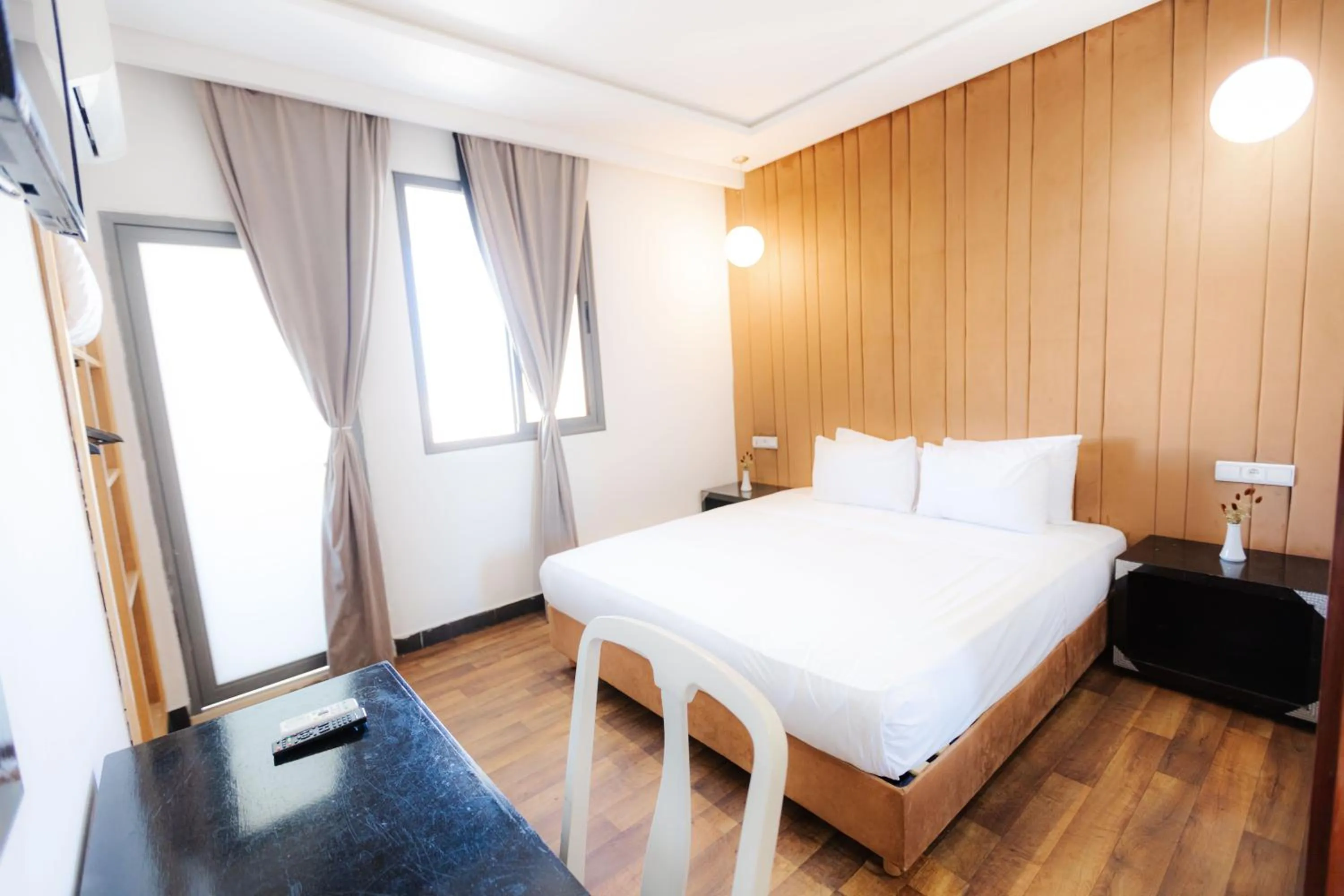 Bed in WINDSOR HOTEL CITY CENTER