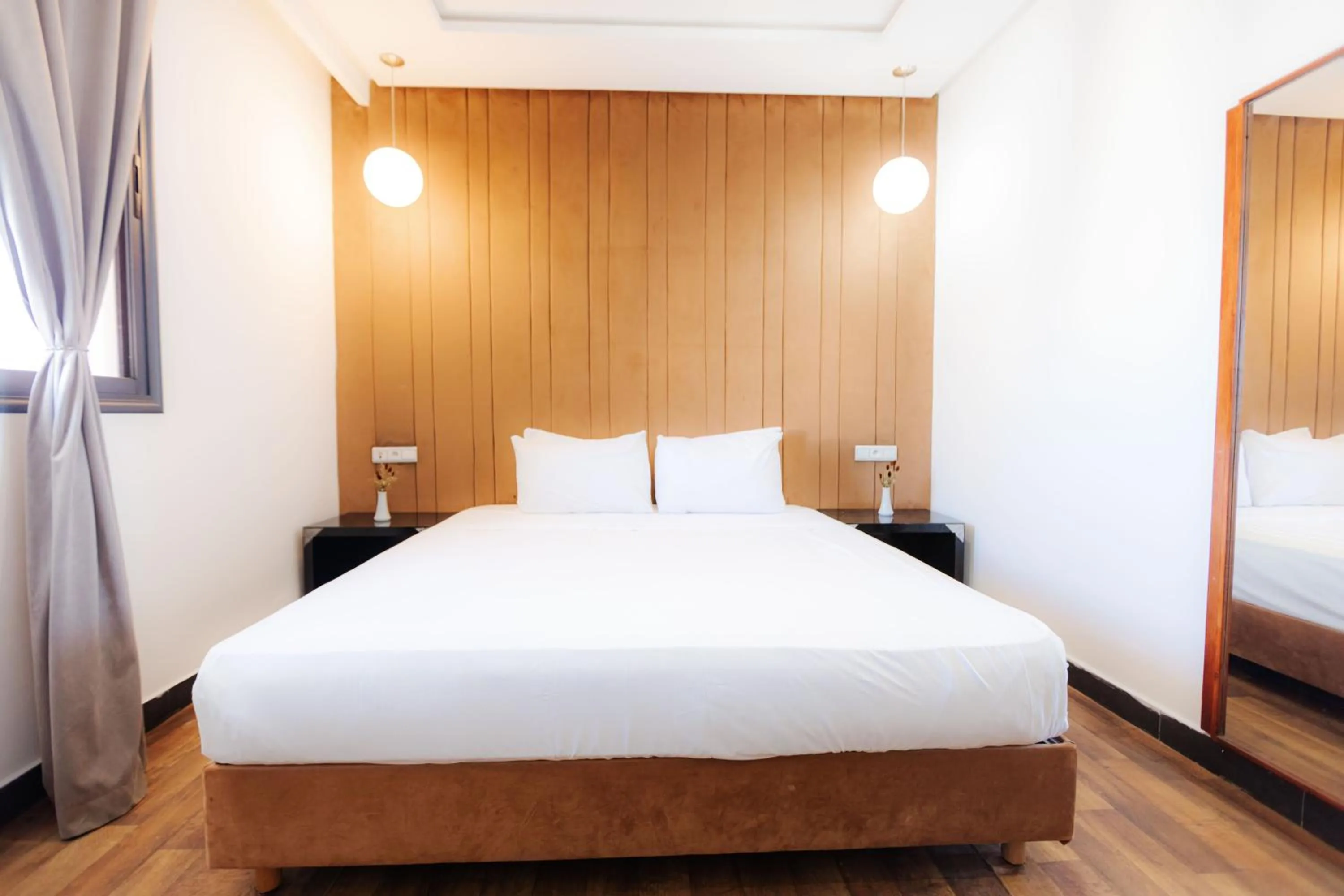 Bed in WINDSOR HOTEL CITY CENTER