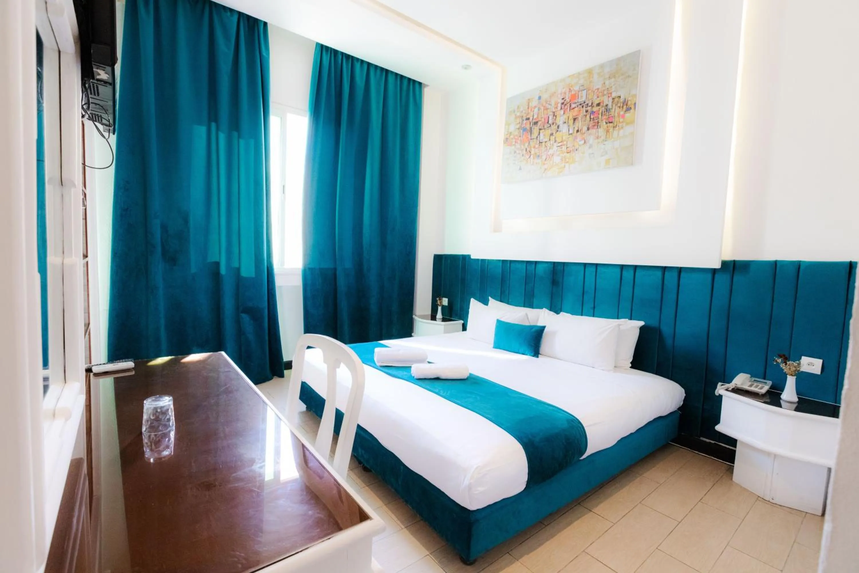 Bed in WINDSOR HOTEL CITY CENTER