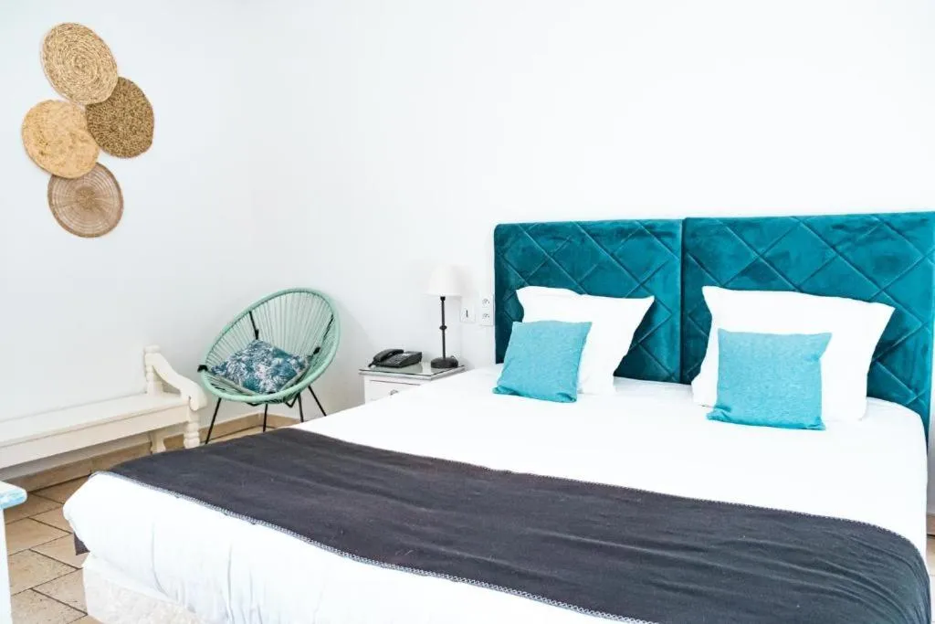 Bed in Logis hôtel et restaurant La Bastide Cabezac