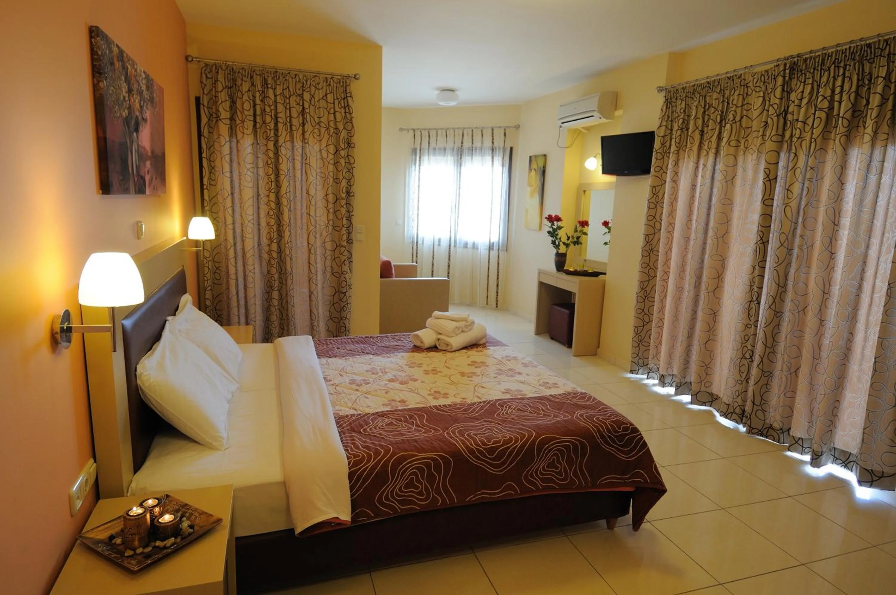 Bed in Faros Luxury Suites