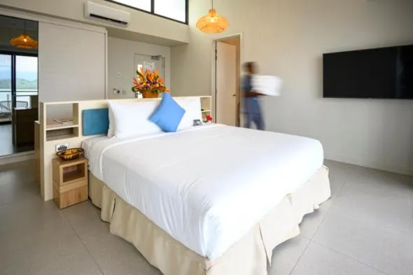 Property building, Bed in Loloata Island Resort