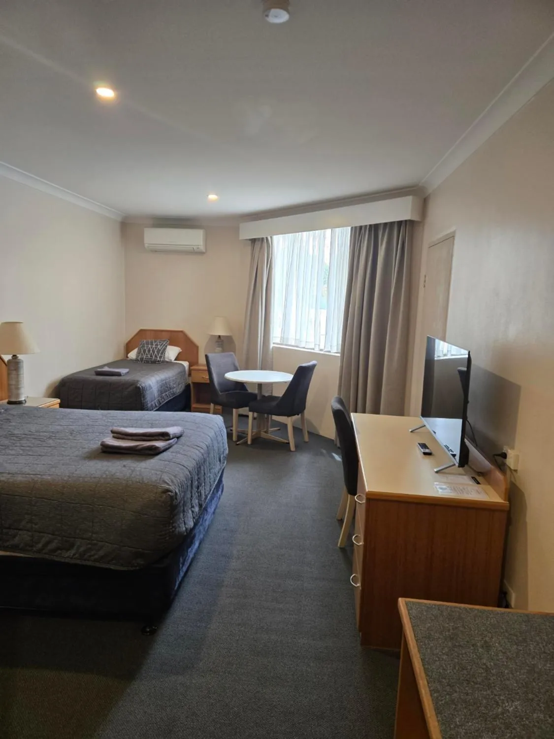 Bed in Charbonnier Motor Inn