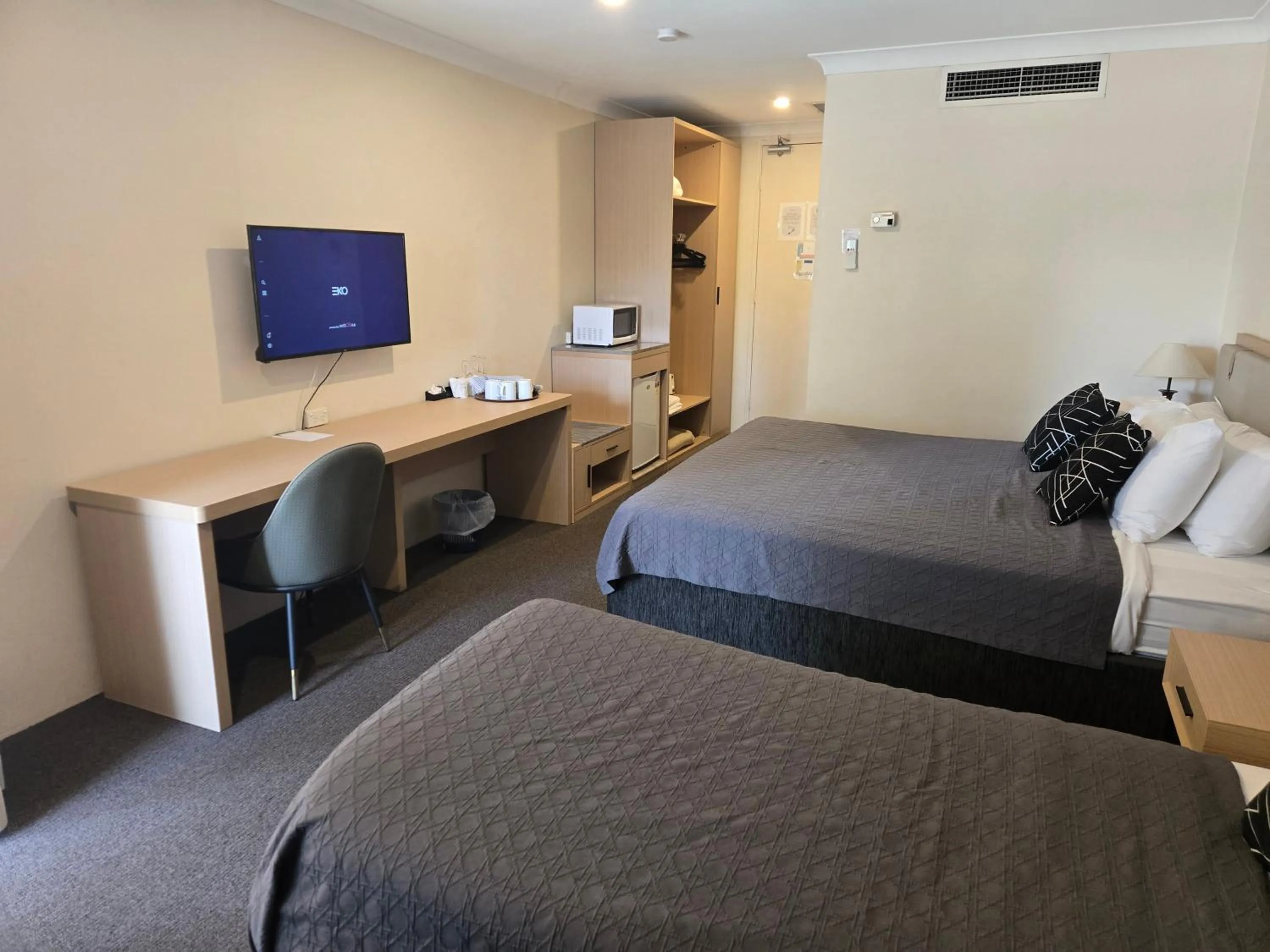 Bed in Charbonnier Motor Inn