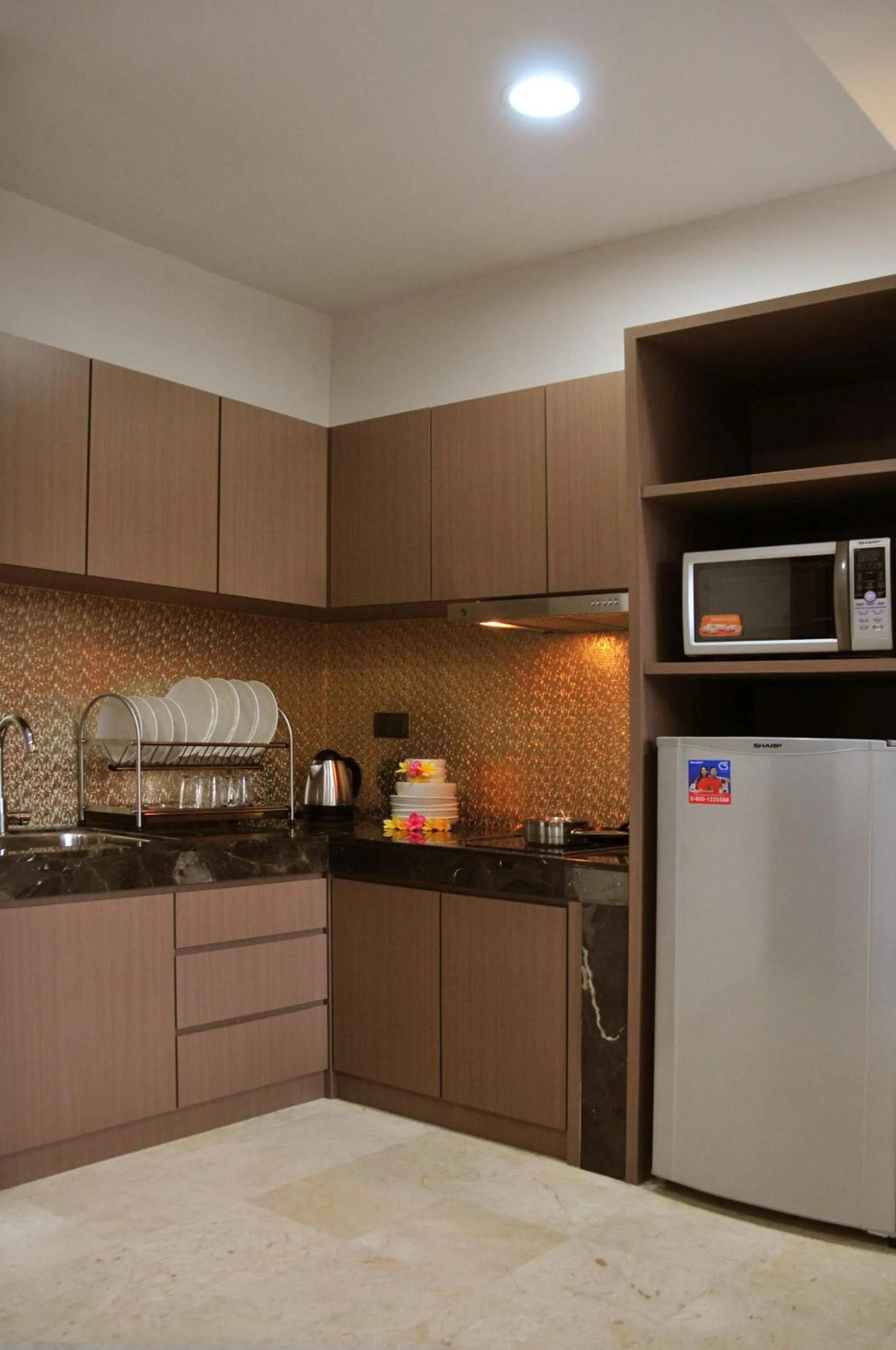 Kitchen or kitchenette in The Centro Hotel & Residence By Orchardz