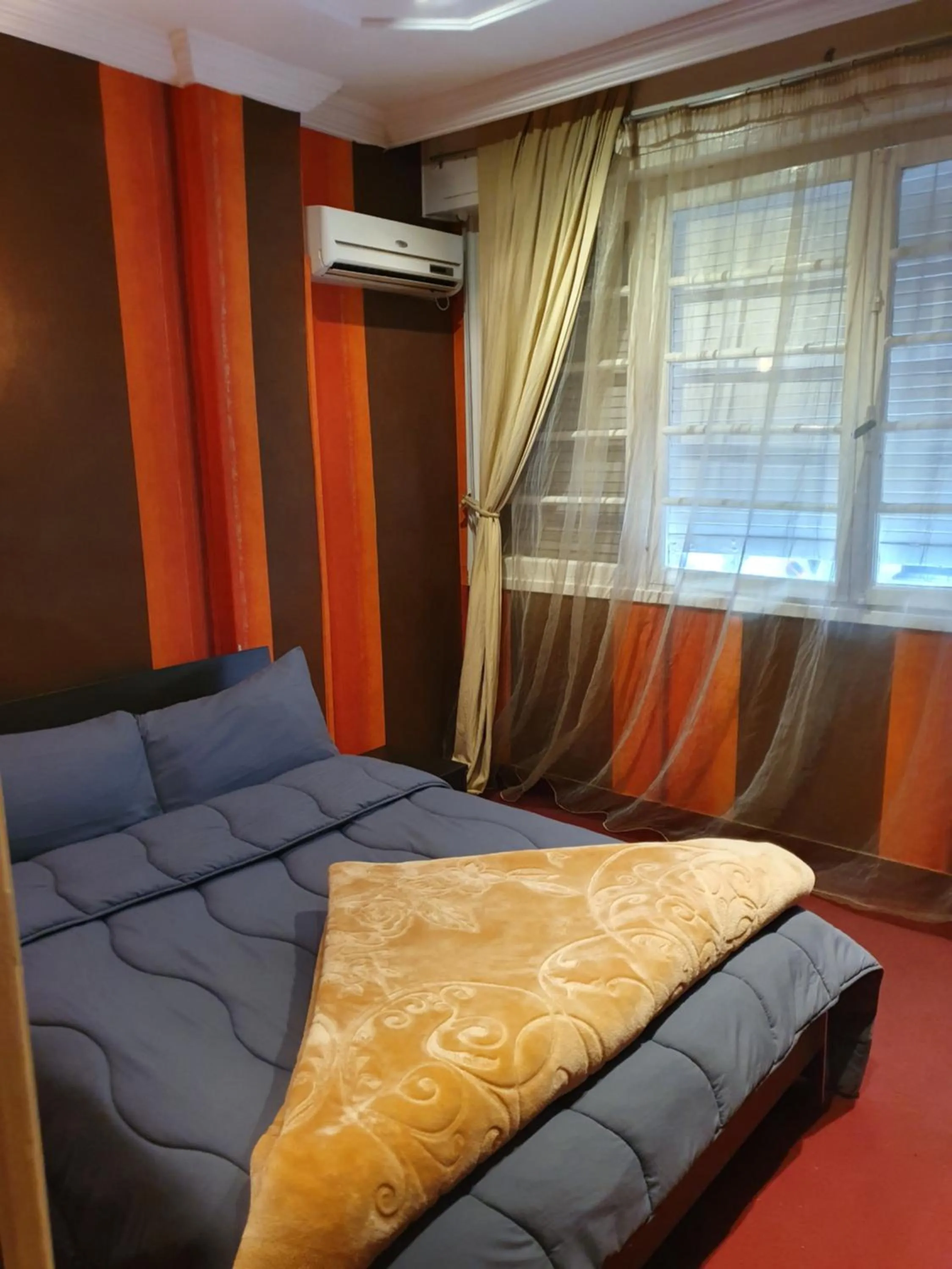 Bed in Ambassy Hotel