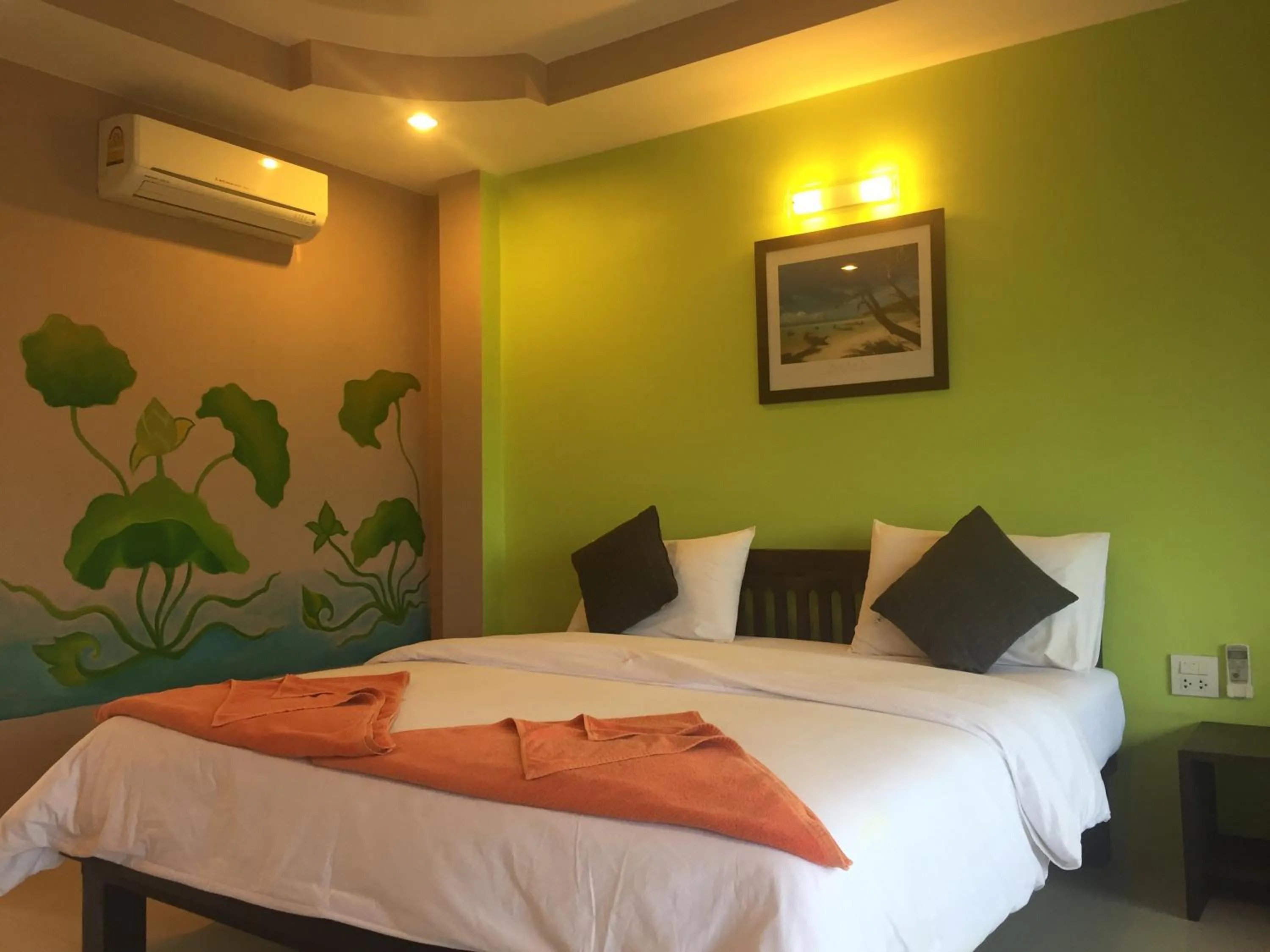 Bed in Baan Suan Ta Hotel