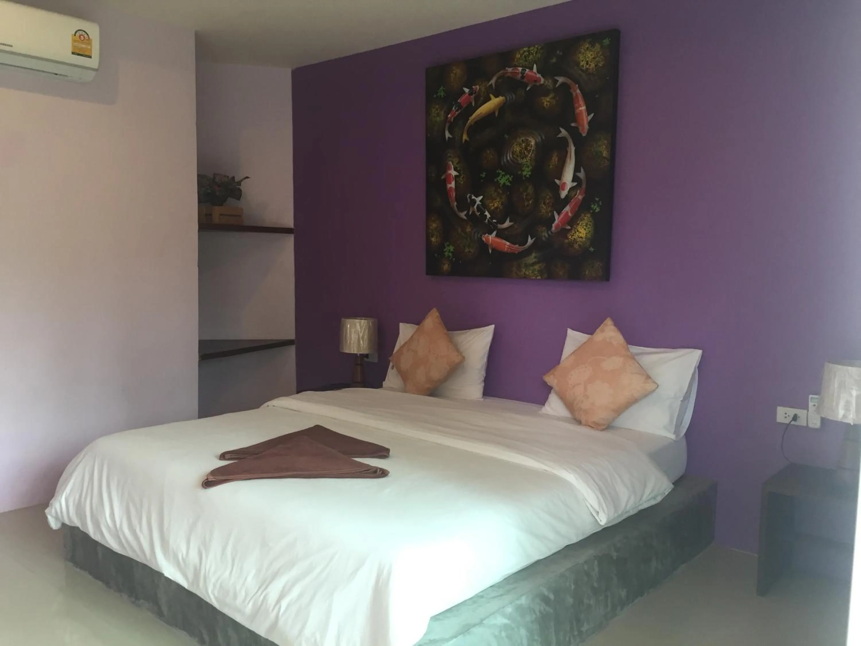 Bed in Baan Suan Ta Hotel