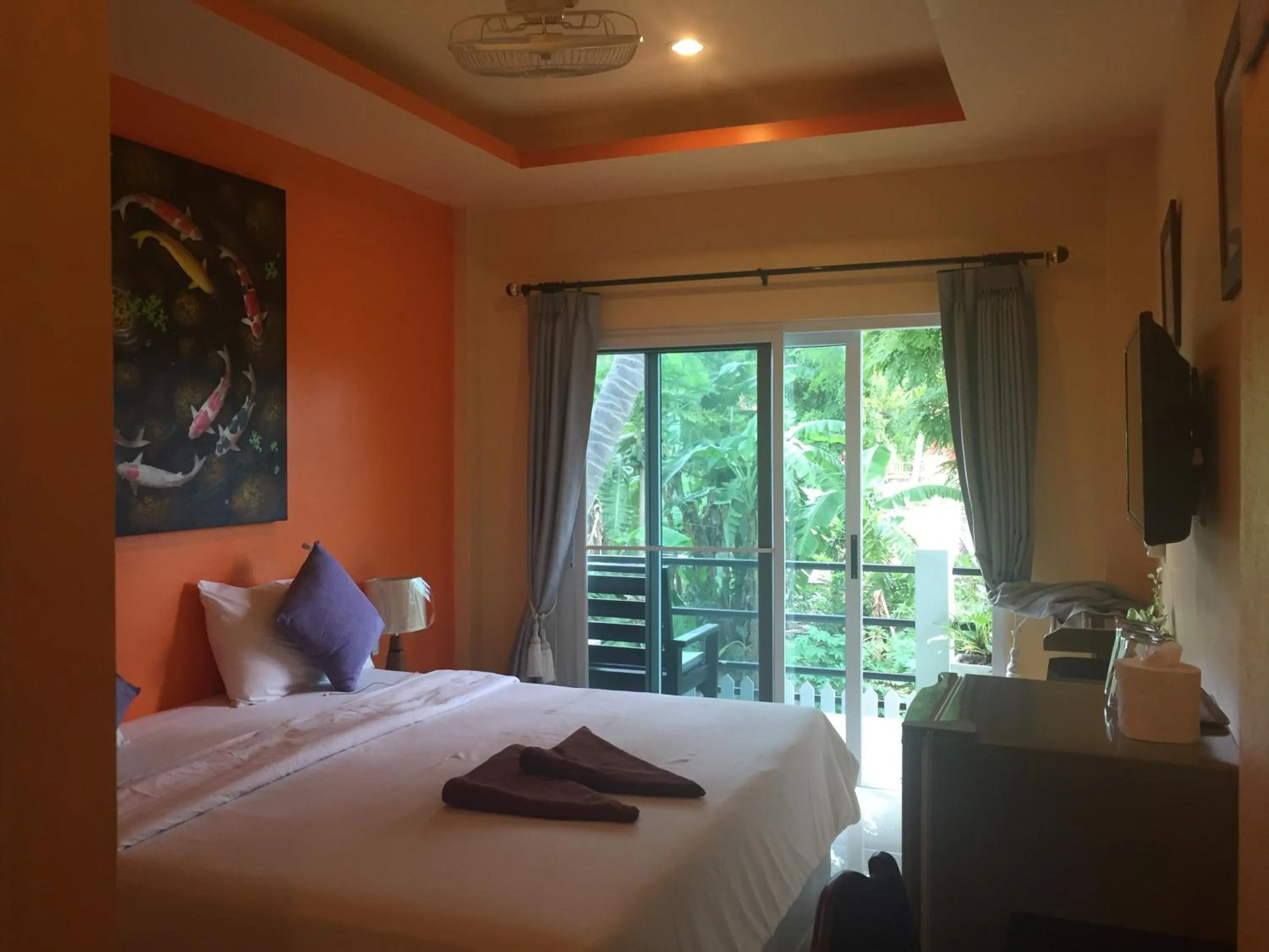 Bed in Baan Suan Ta Hotel