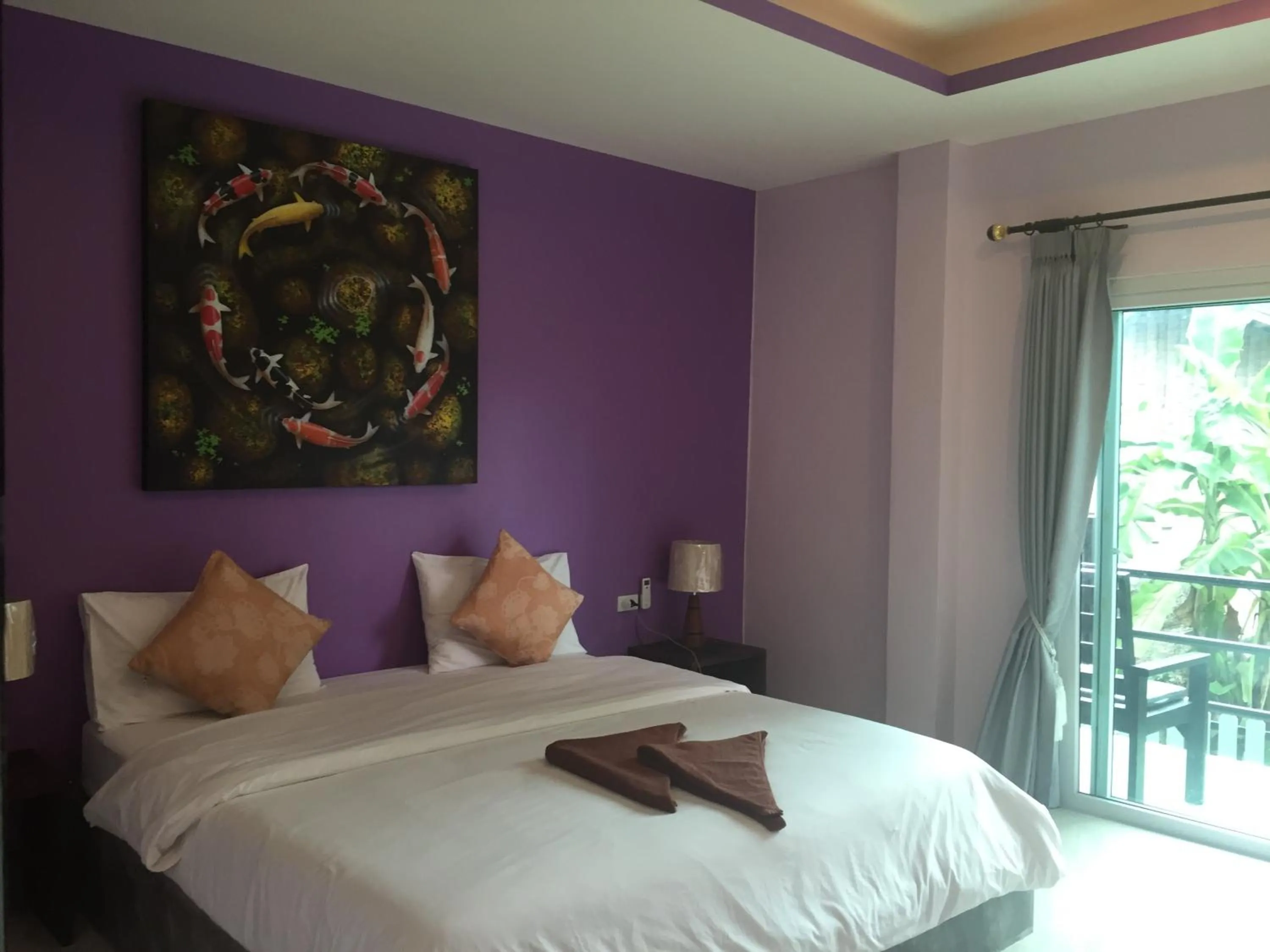 Bed in Baan Suan Ta Hotel