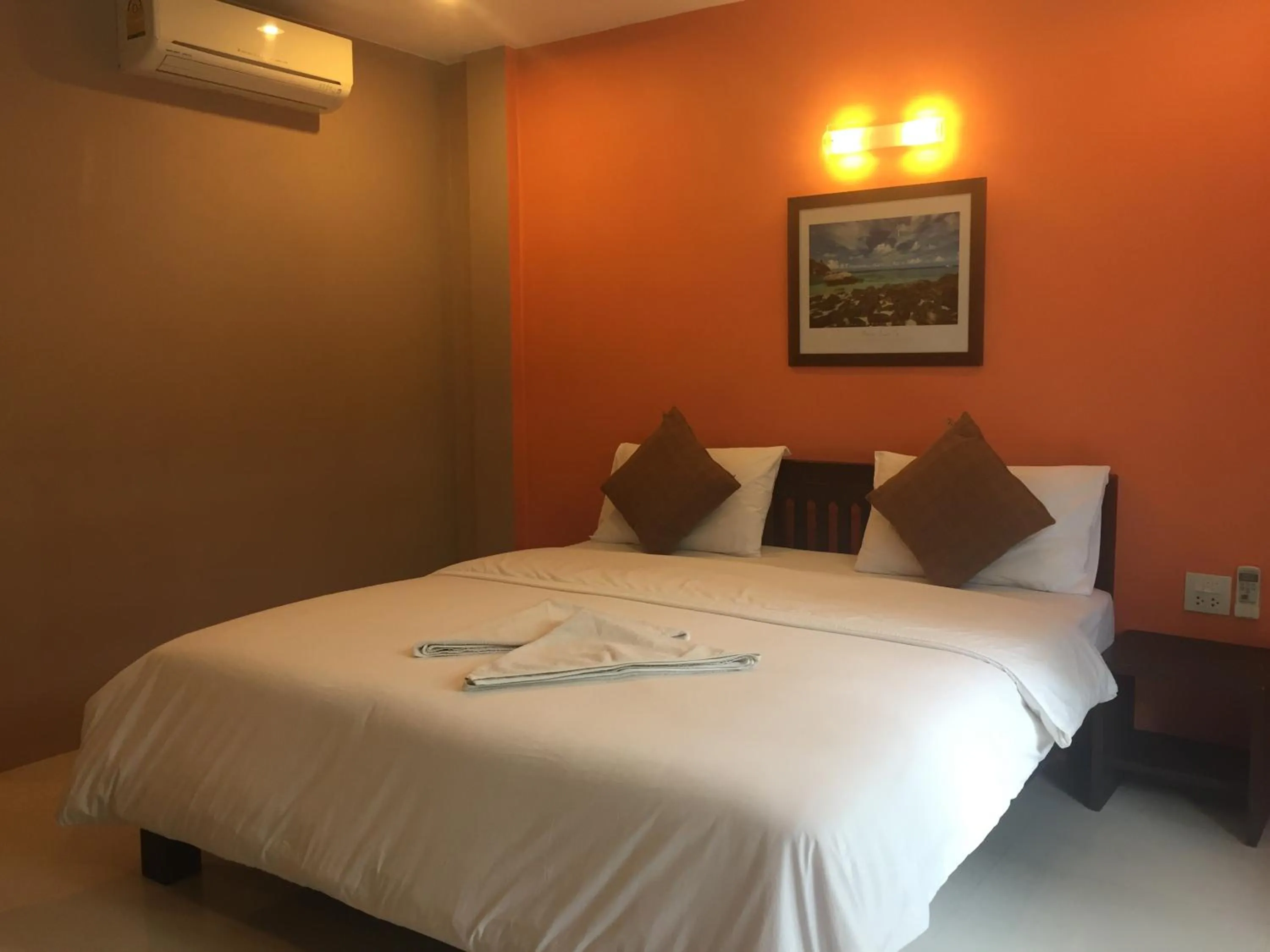 Bed in Baan Suan Ta Hotel