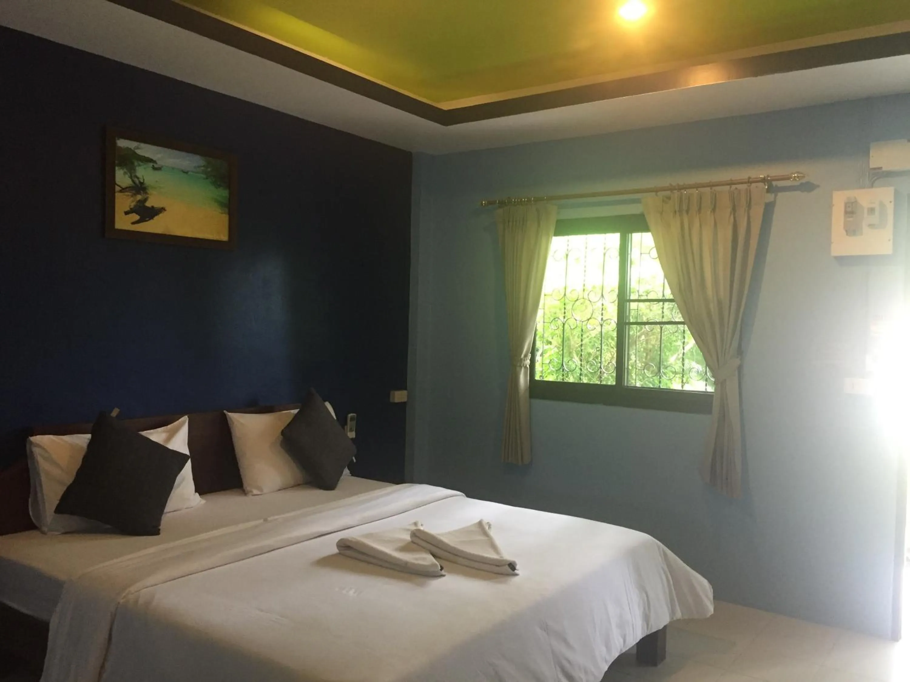 Bed in Baan Suan Ta Hotel