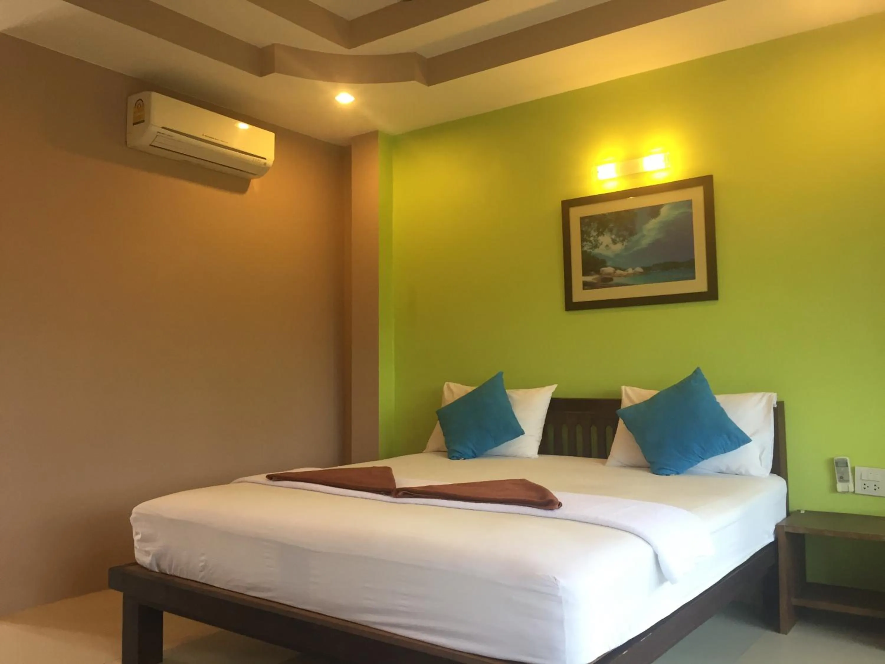 Bed in Baan Suan Ta Hotel