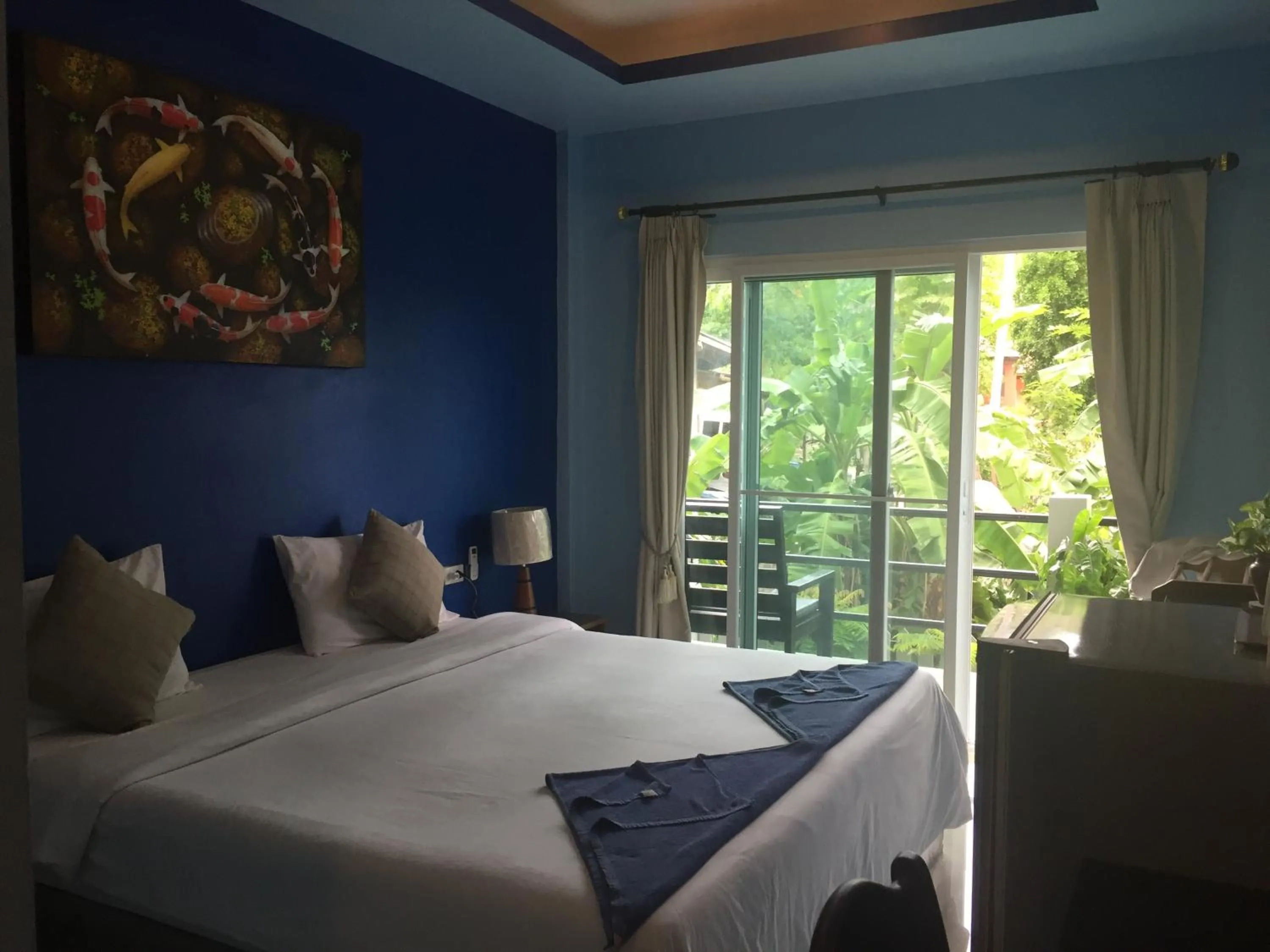 Bed in Baan Suan Ta Hotel