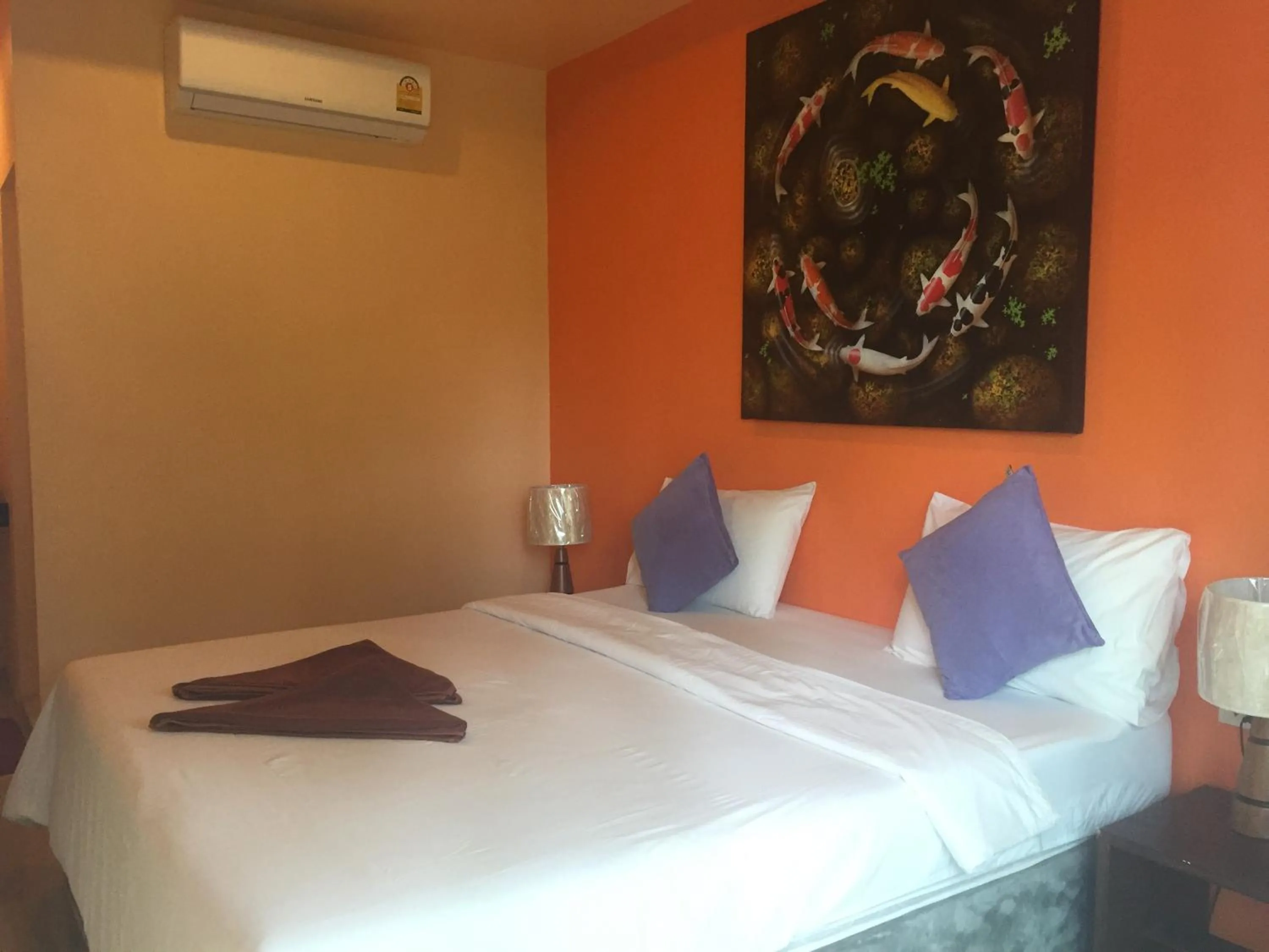 Bed in Baan Suan Ta Hotel