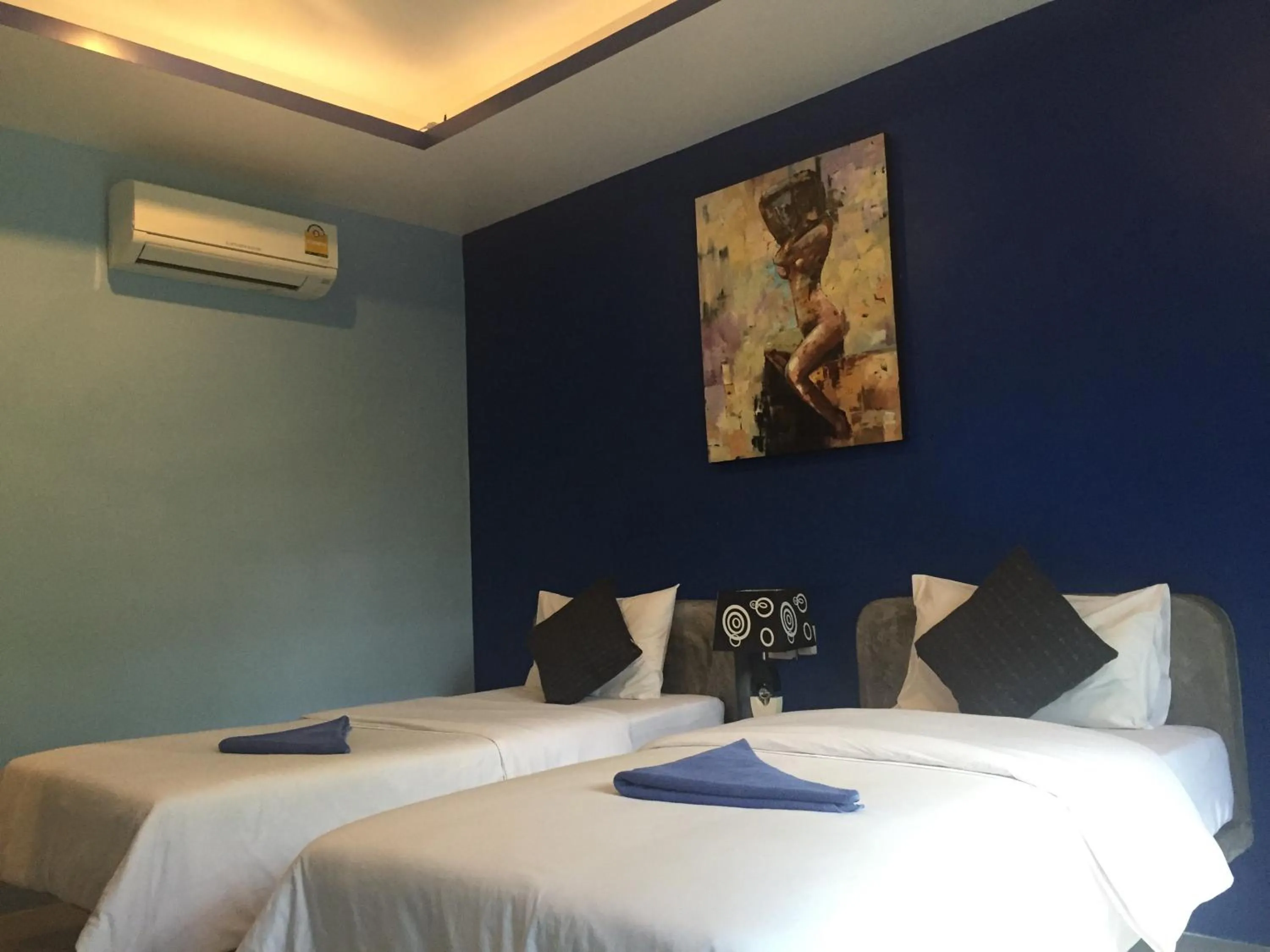 Bed in Baan Suan Ta Hotel