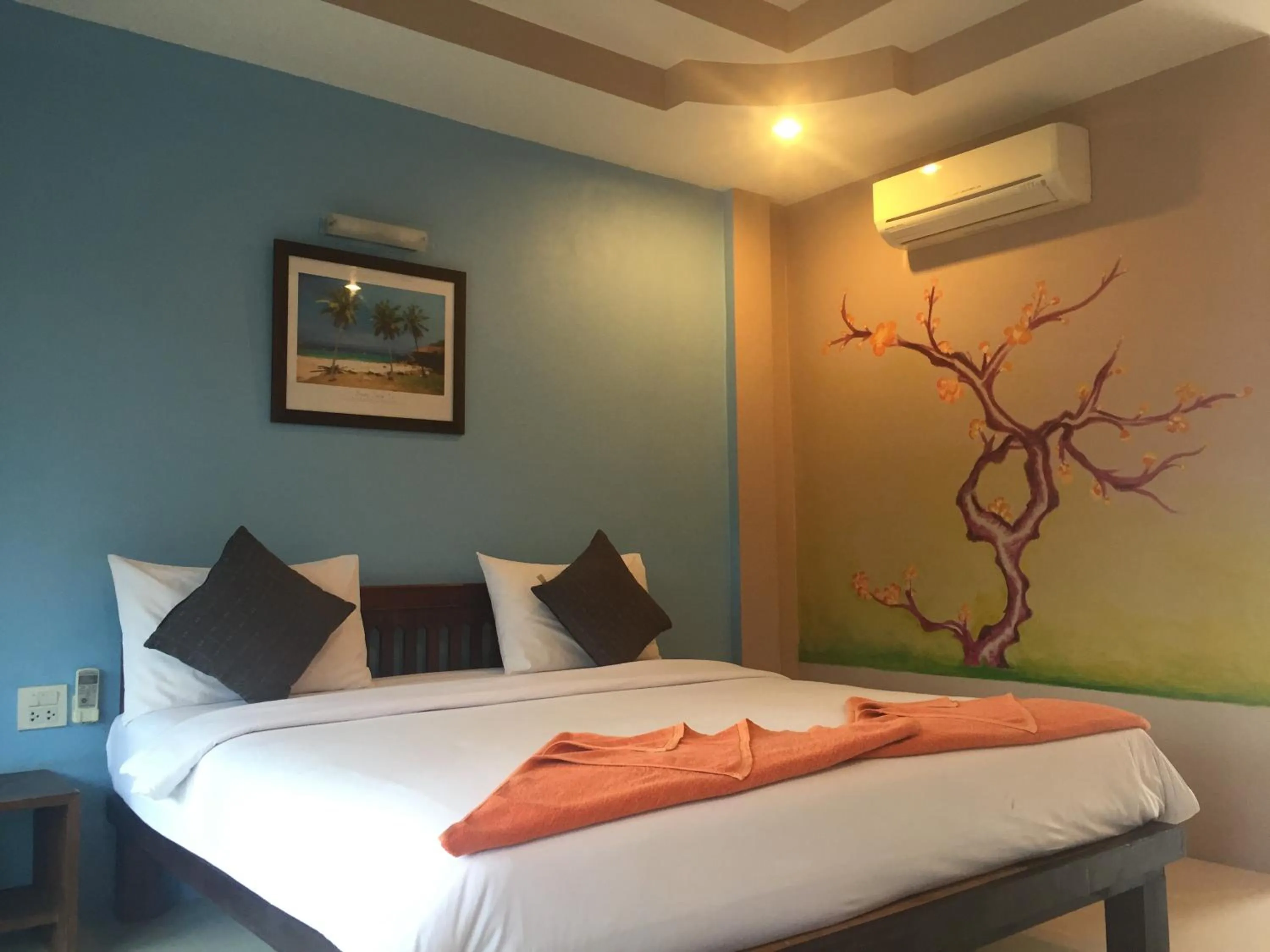 Bed in Baan Suan Ta Hotel