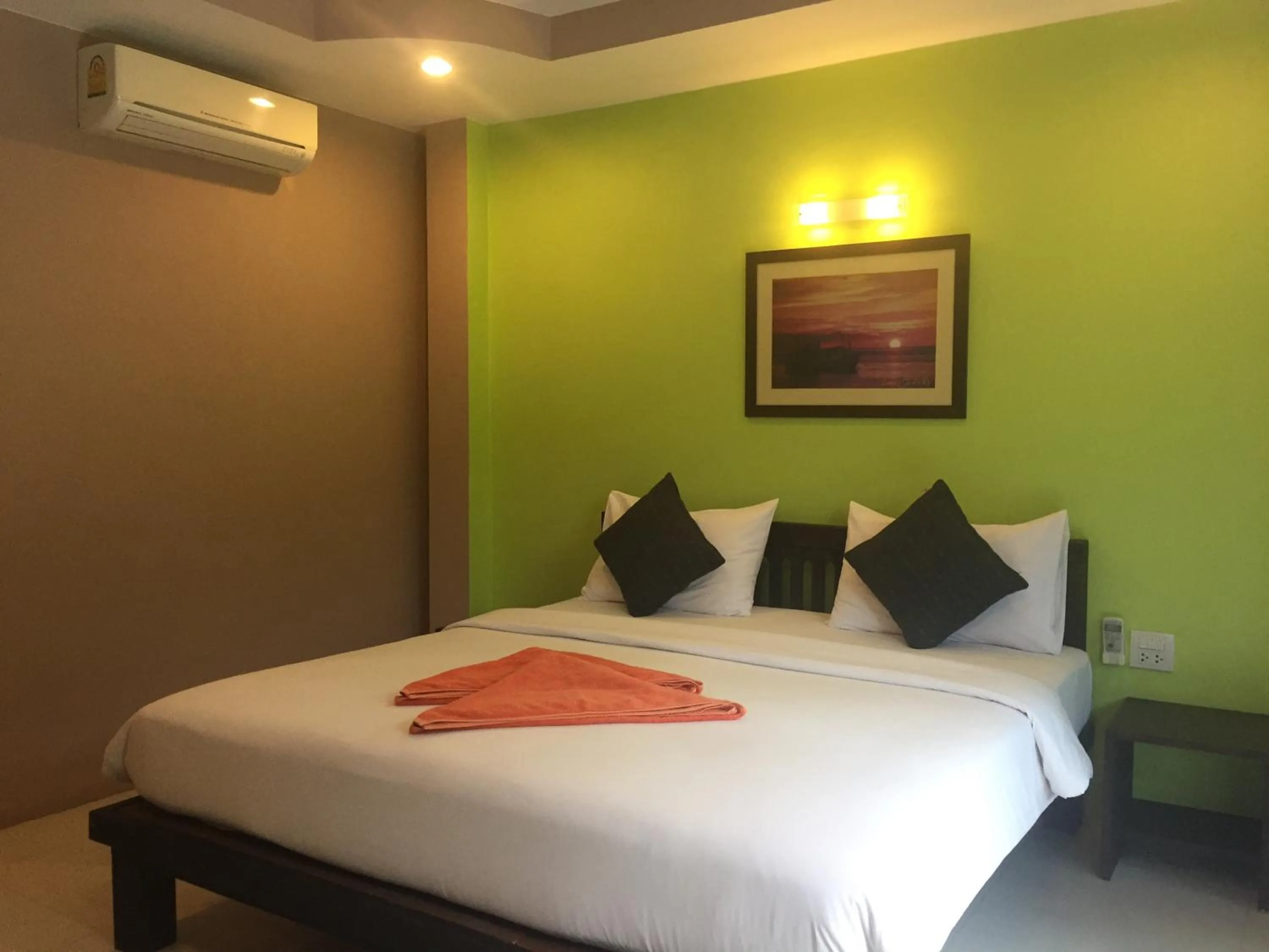 Bed in Baan Suan Ta Hotel