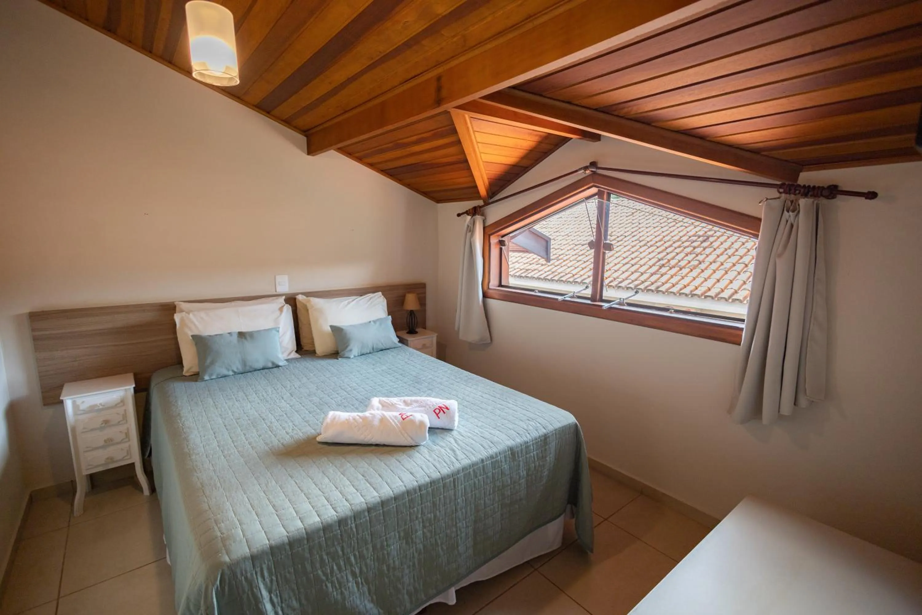 Bed in Pousada Nefelibatas