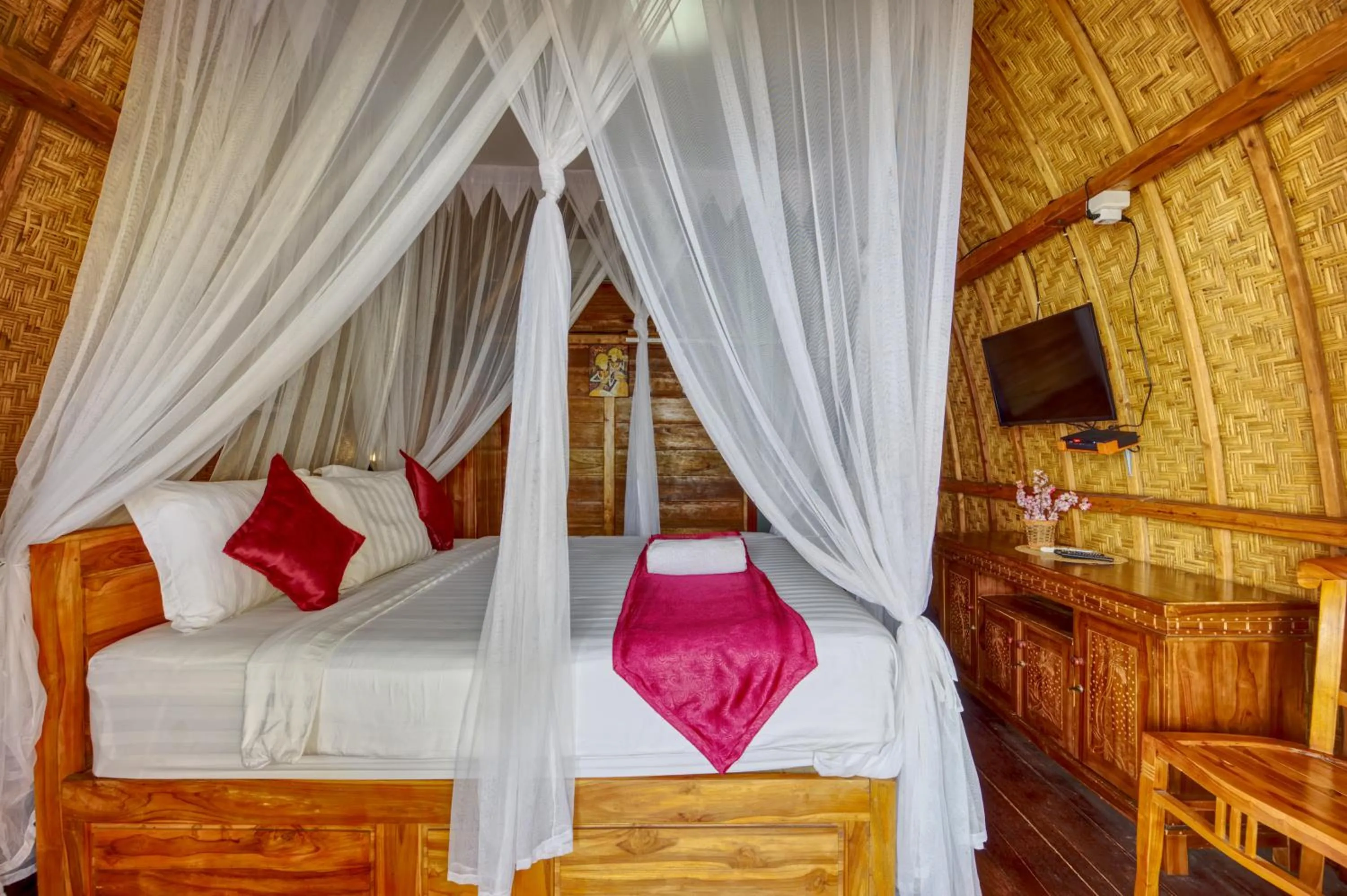 Bed in Santen Beach Bungalows