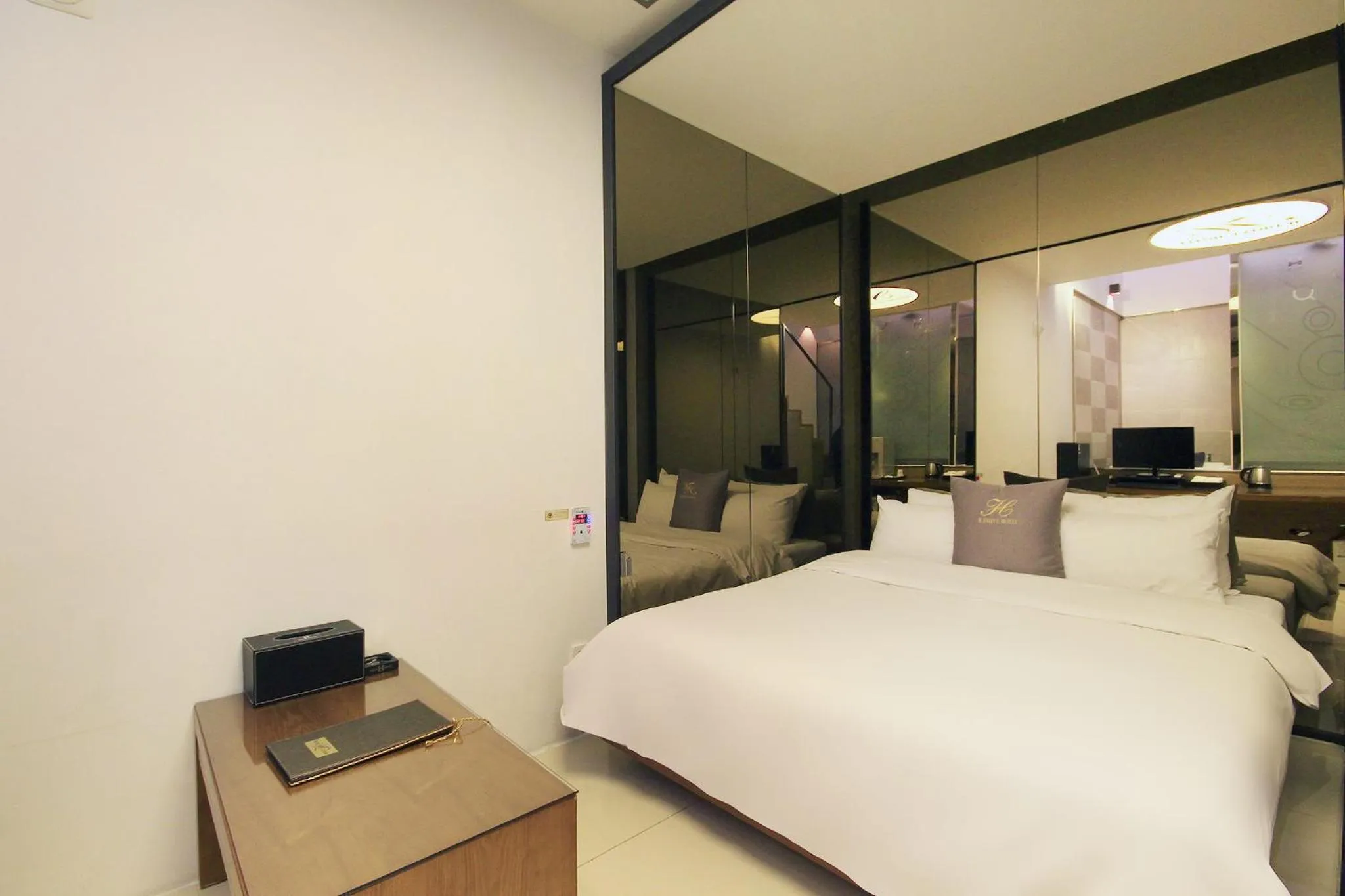 Bed in H Drive Hotel