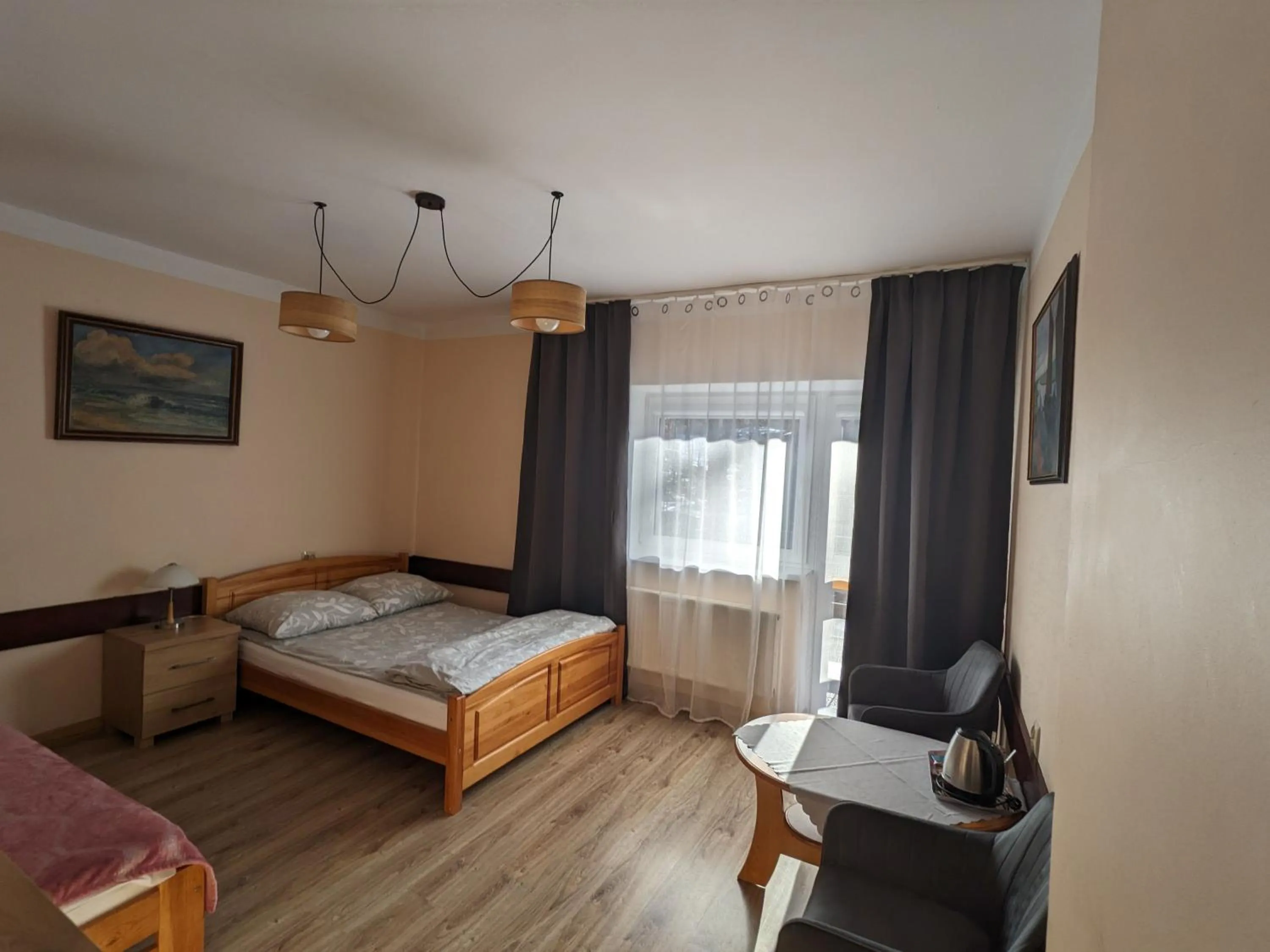 Communal lounge/ TV room, Bed in Dom wczasowy Przy Skałkach