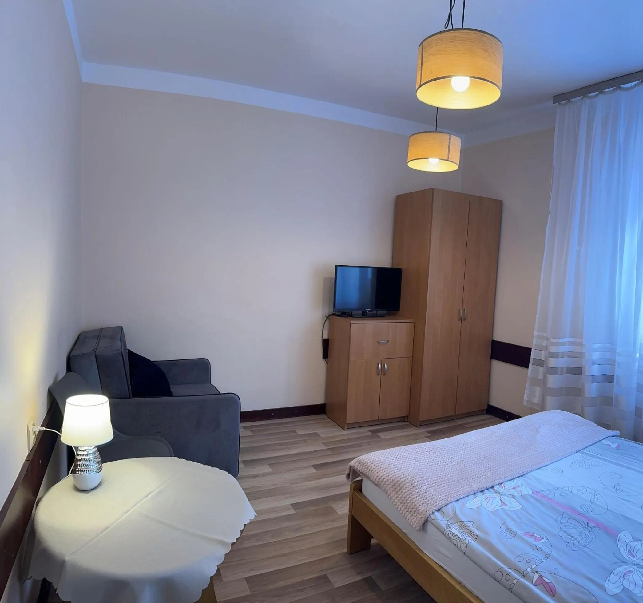 Communal lounge/ TV room, Bed in Dom wczasowy Przy Skałkach