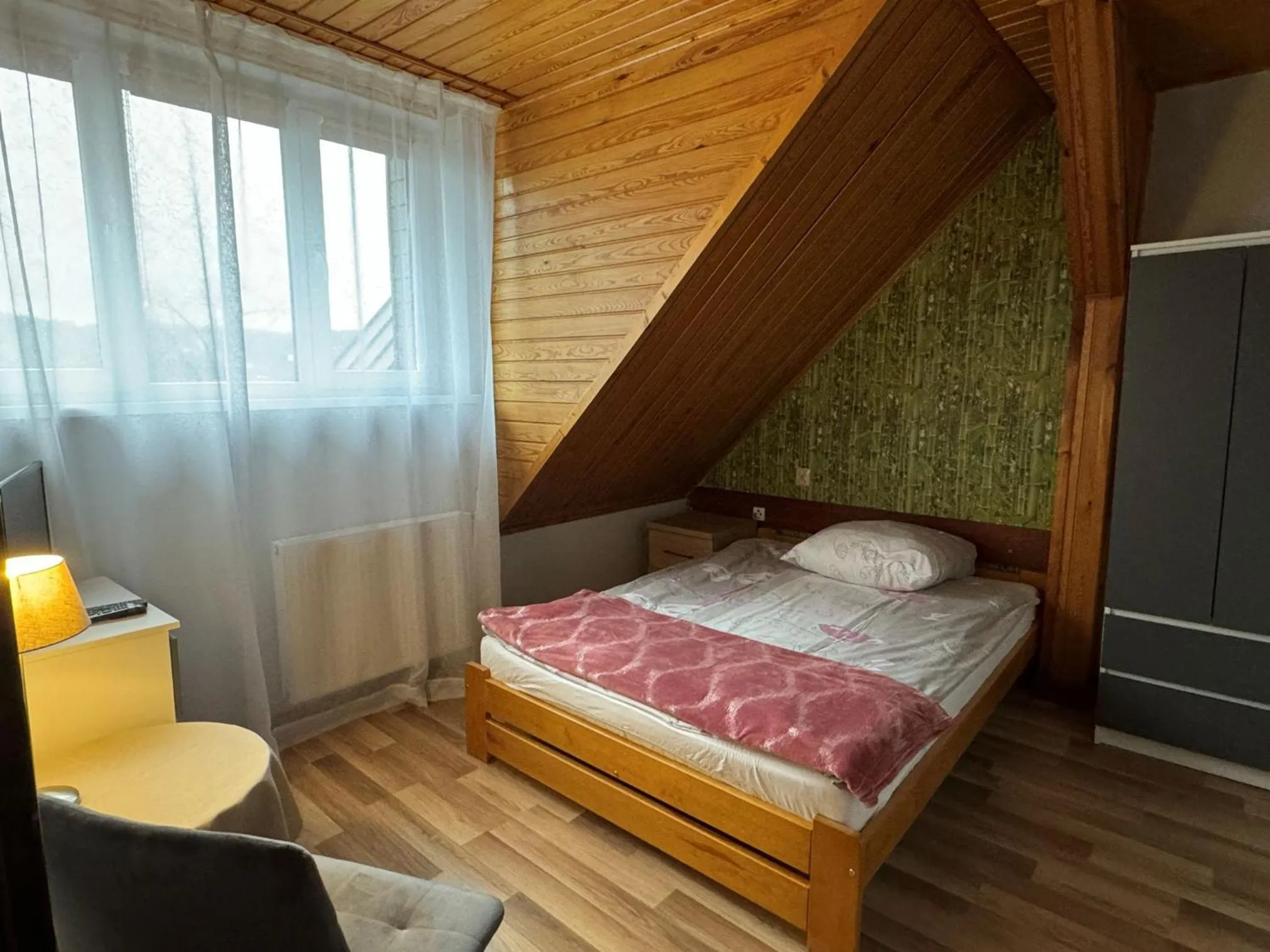 Communal lounge/ TV room, Bed in Dom wczasowy Przy Skałkach