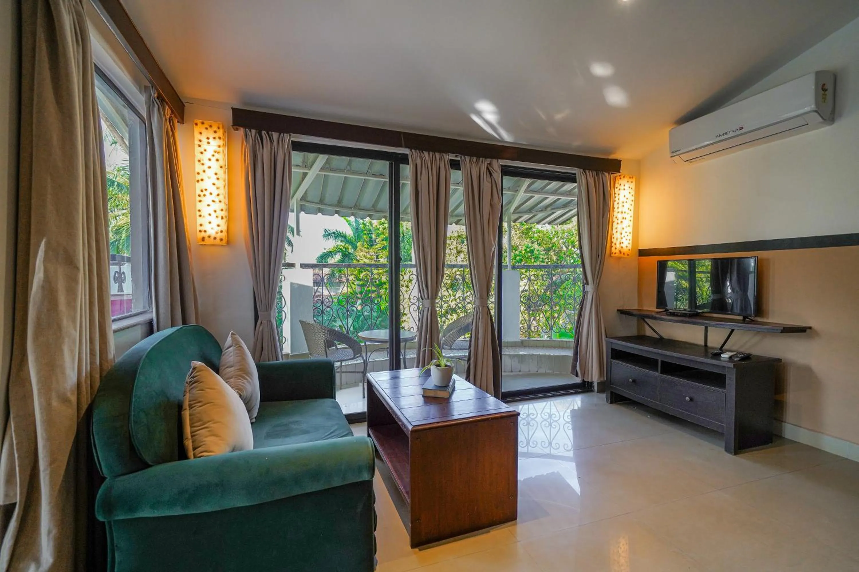 TV and multimedia in Olive Hotel Alidia Beach Resort by Embassy Group