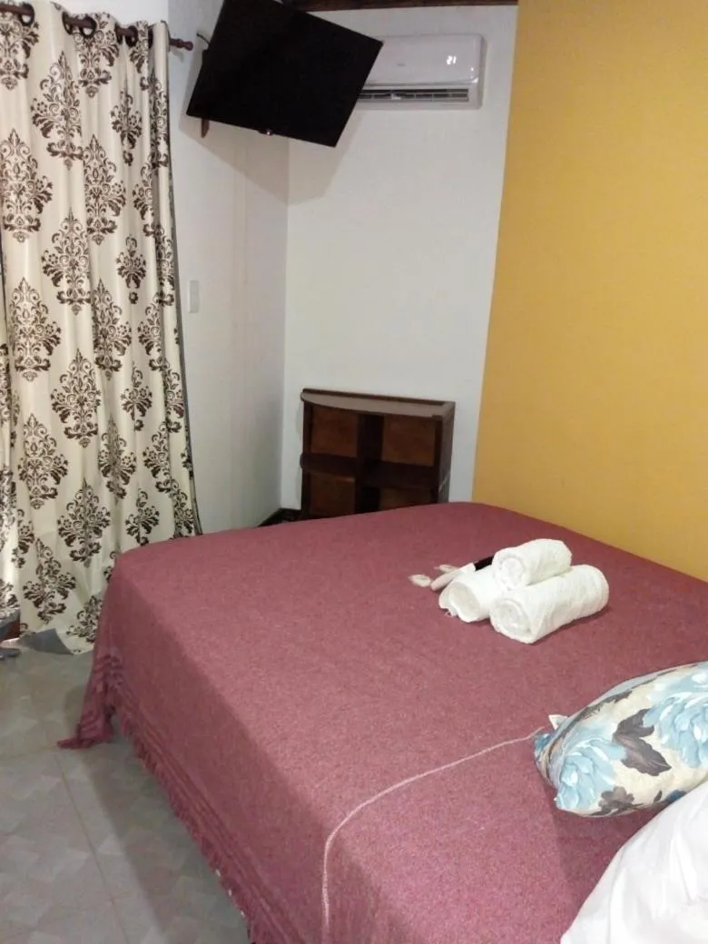 Bed in El Uru Suite Hotel