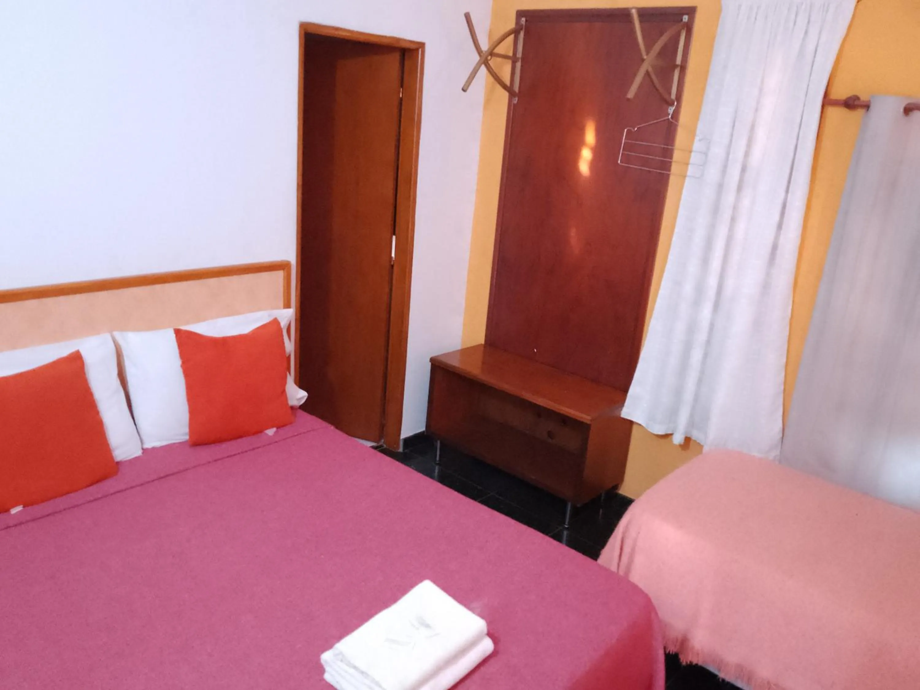 Bed in El Uru Suite Hotel