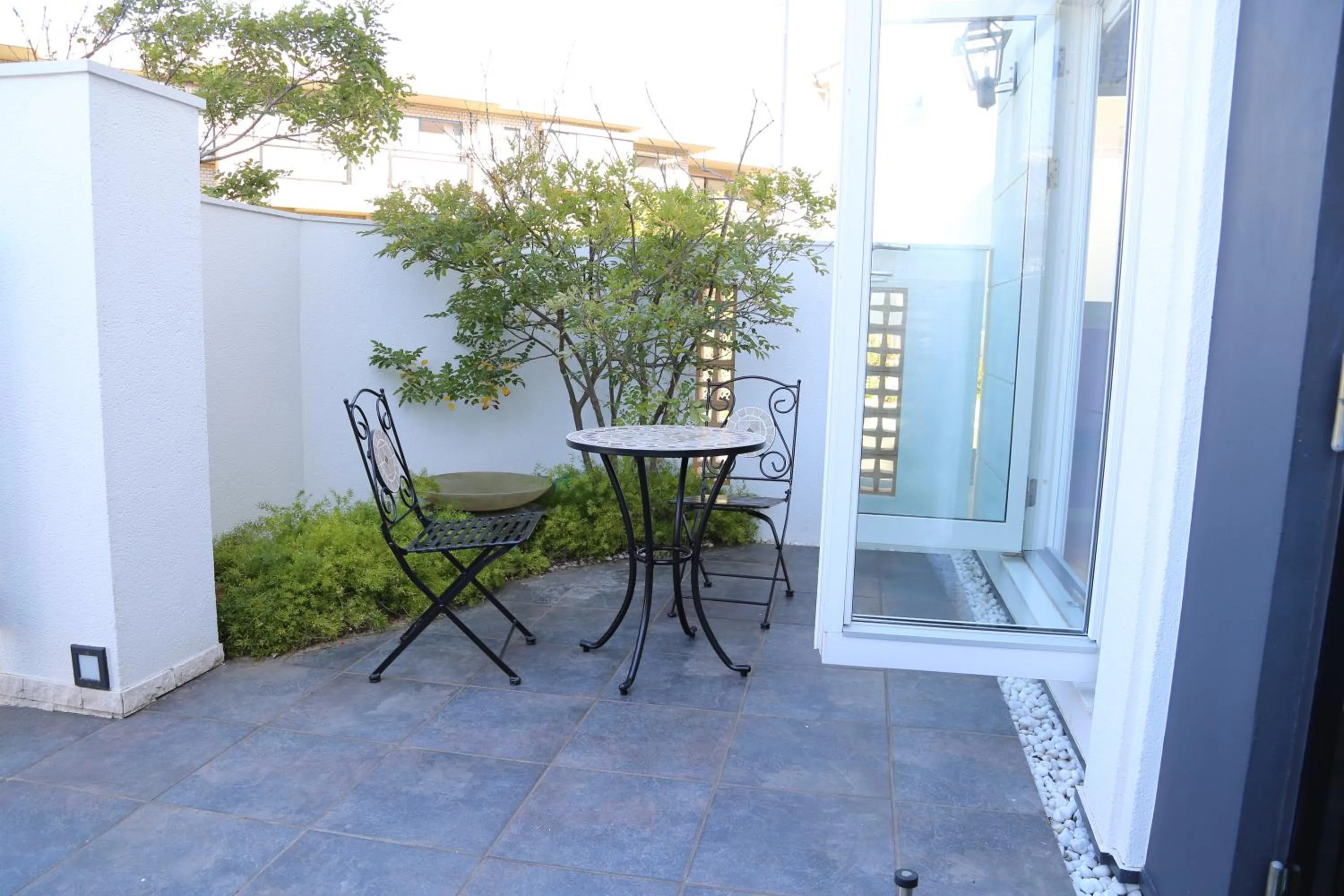 Patio in Tabinoteitaku Kamakura Yuigahama -Homann Concept-