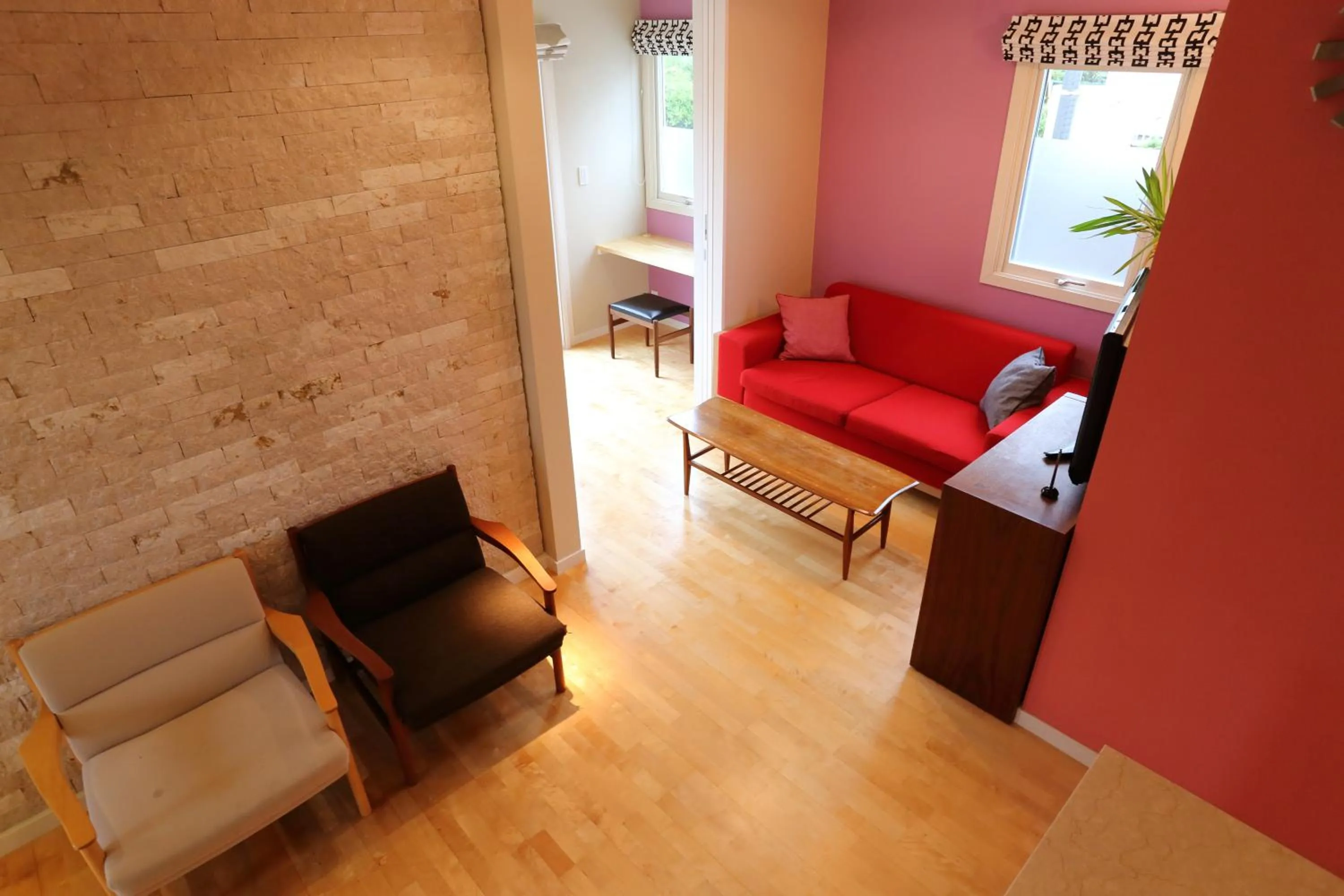 Living room in Tabinoteitaku Kamakura Yuigahama -Homann Concept-