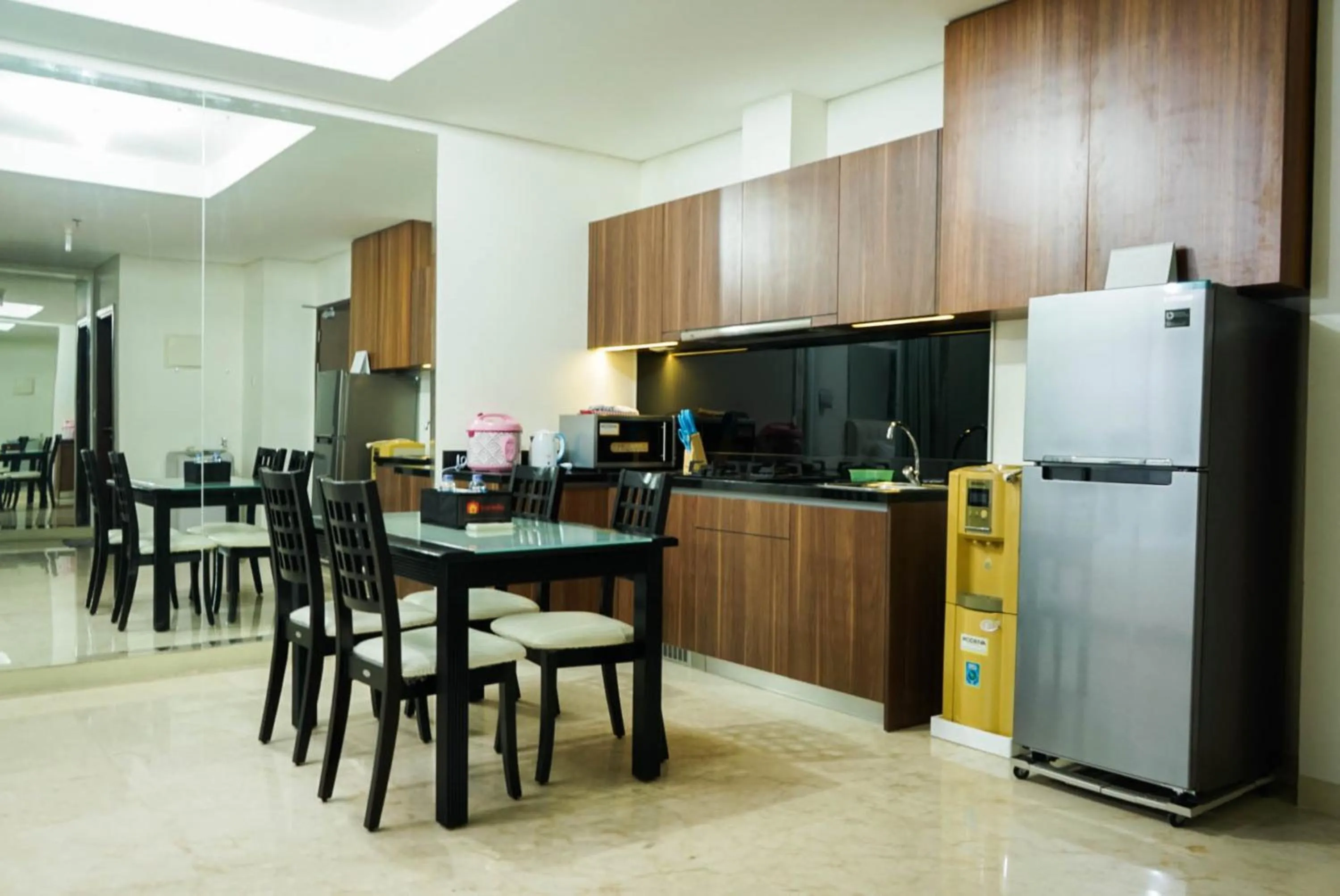 Kitchen or kitchenette in 2BR with Study Room at L'Avenue Apartment By Travelio