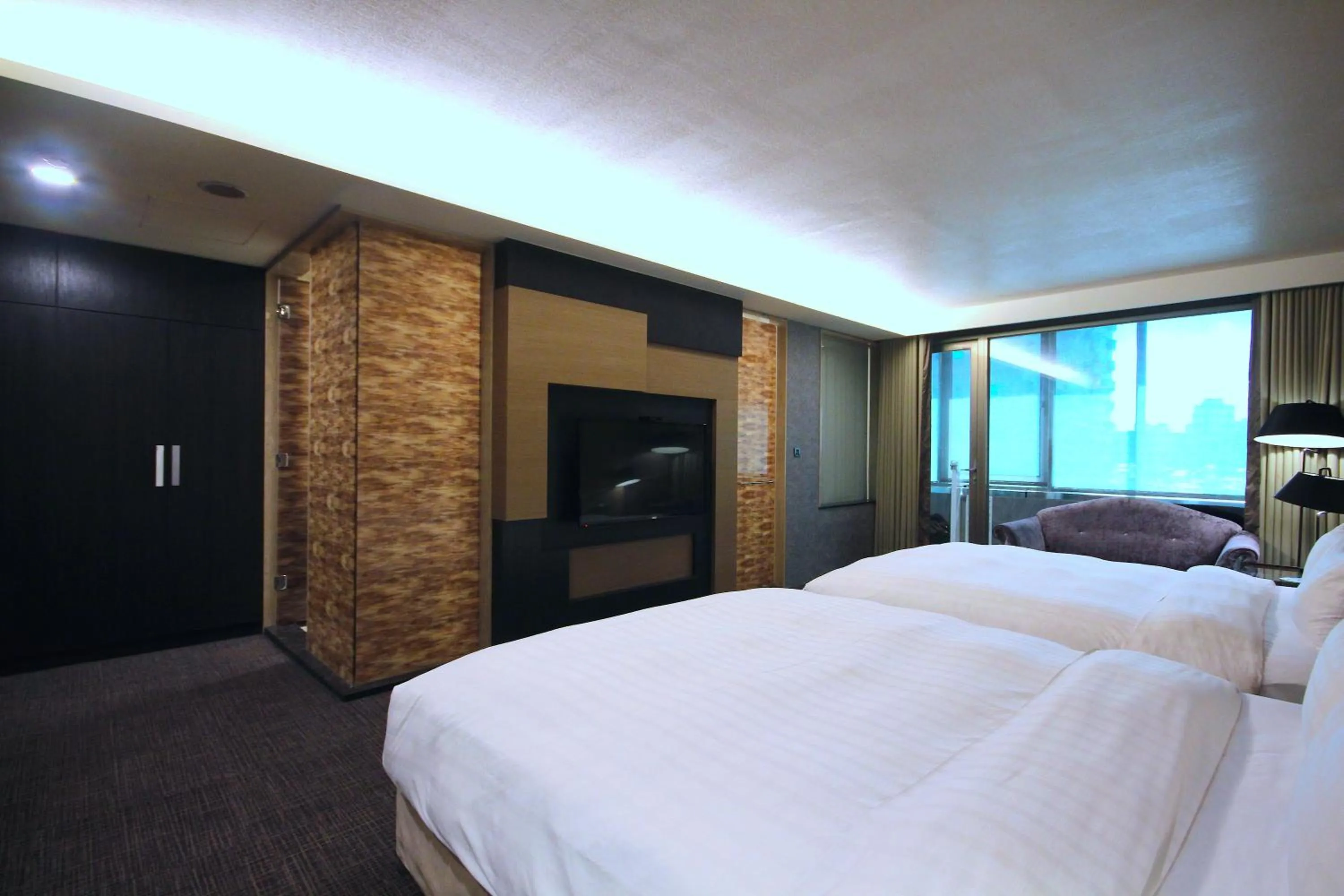 Bed in Hotel Geight Taipei