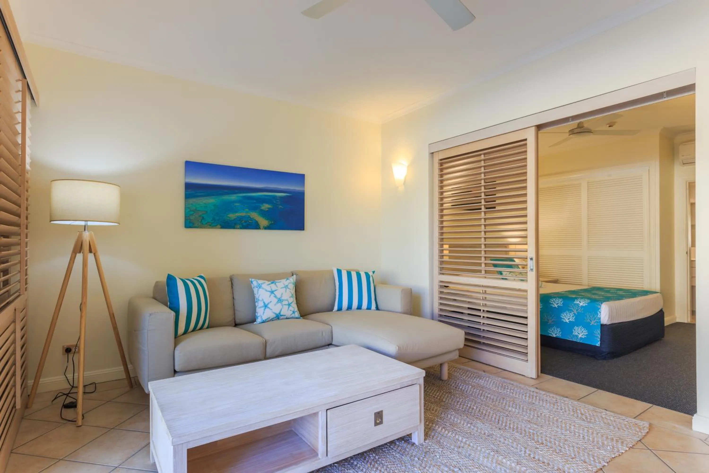 Living room, Bed in Macrossan House Boutique Holiday Apartments