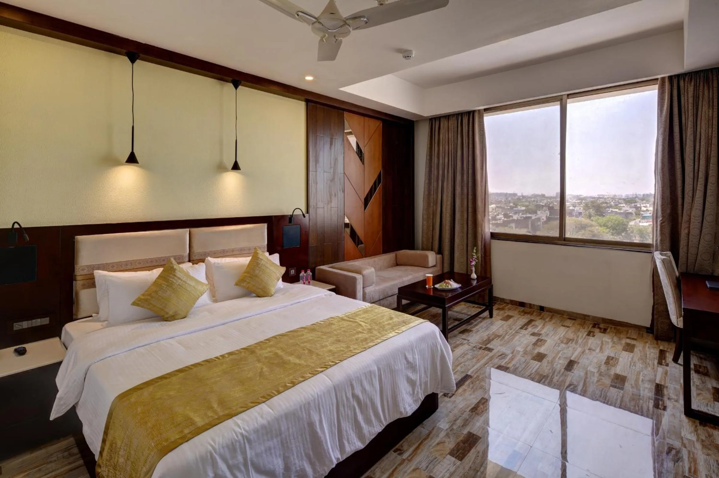 Photo of the whole room, Bed in Regenta Inn Ranip Ahmedabad