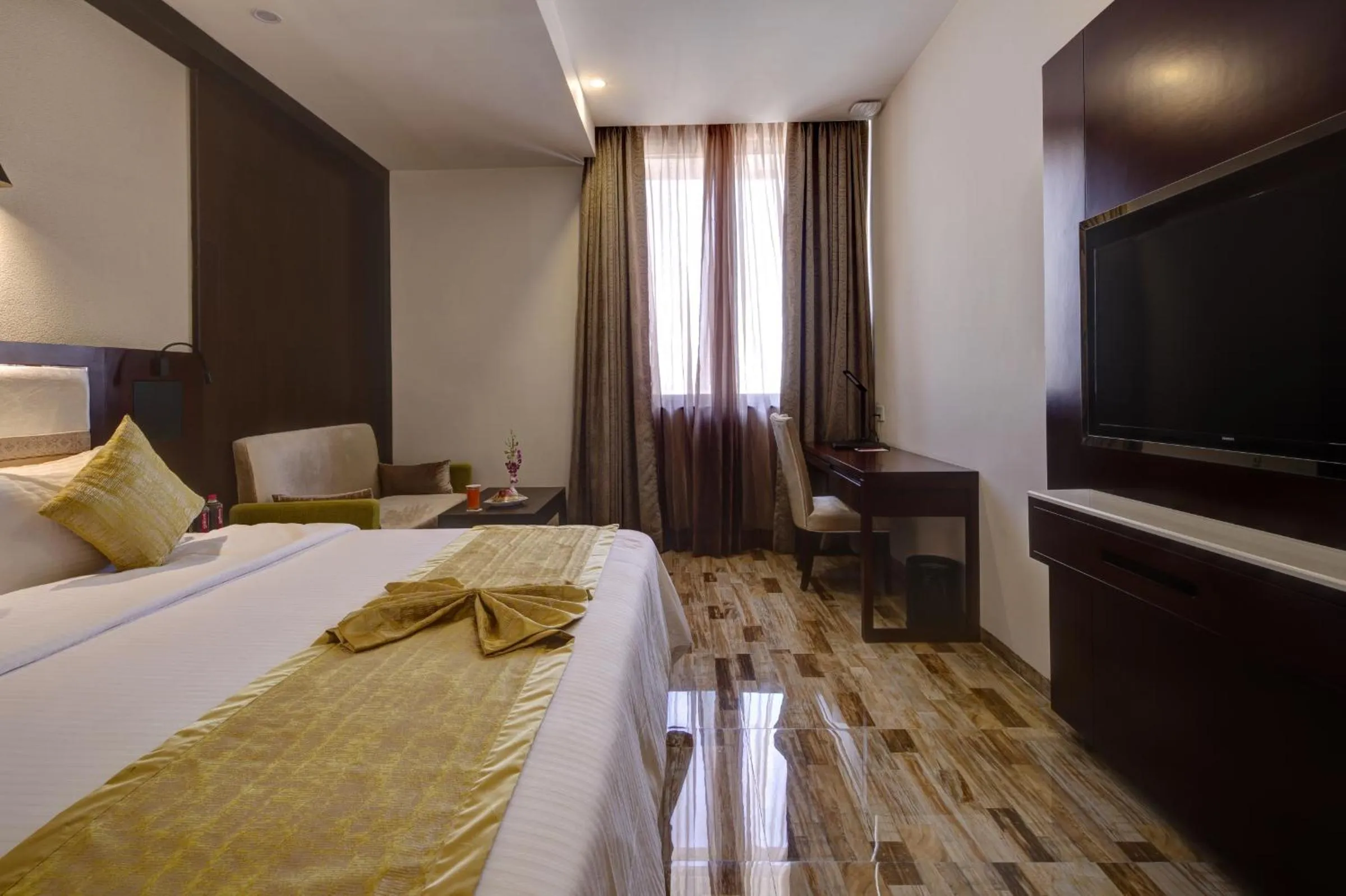 Photo of the whole room, Bed in Regenta Inn Ranip Ahmedabad