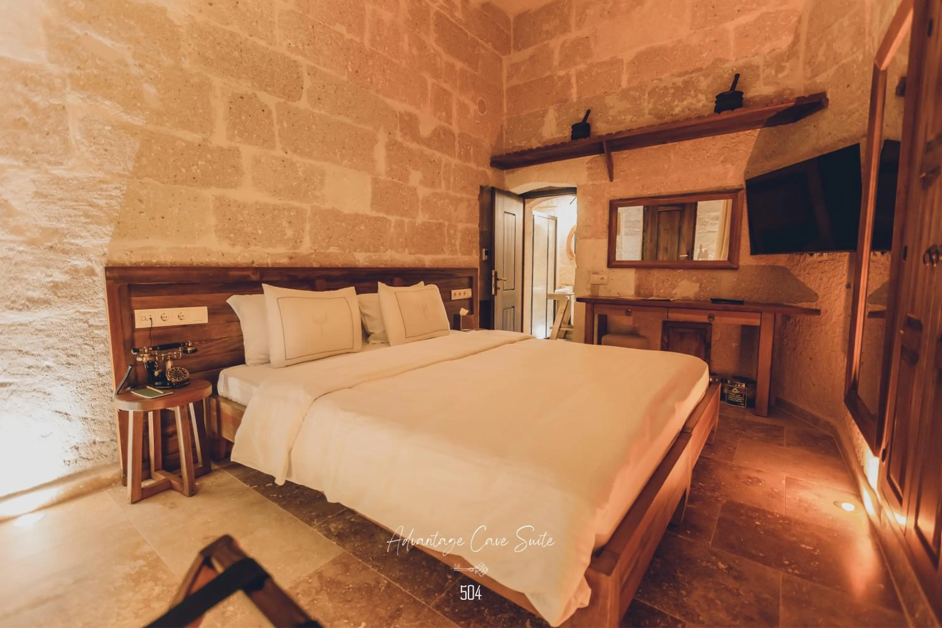 Bed in Nino Cave Suites