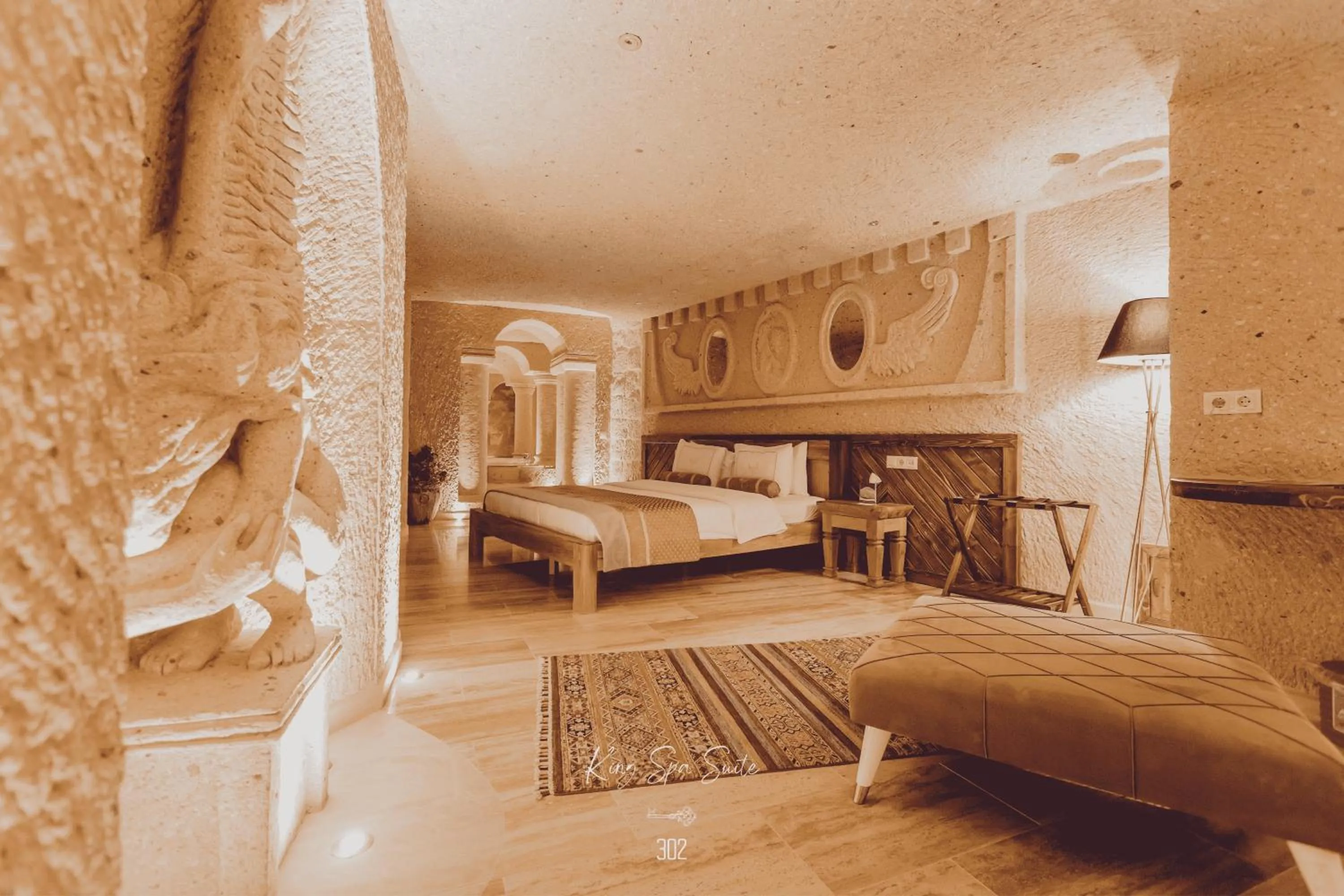 Bed in Nino Cave Suites