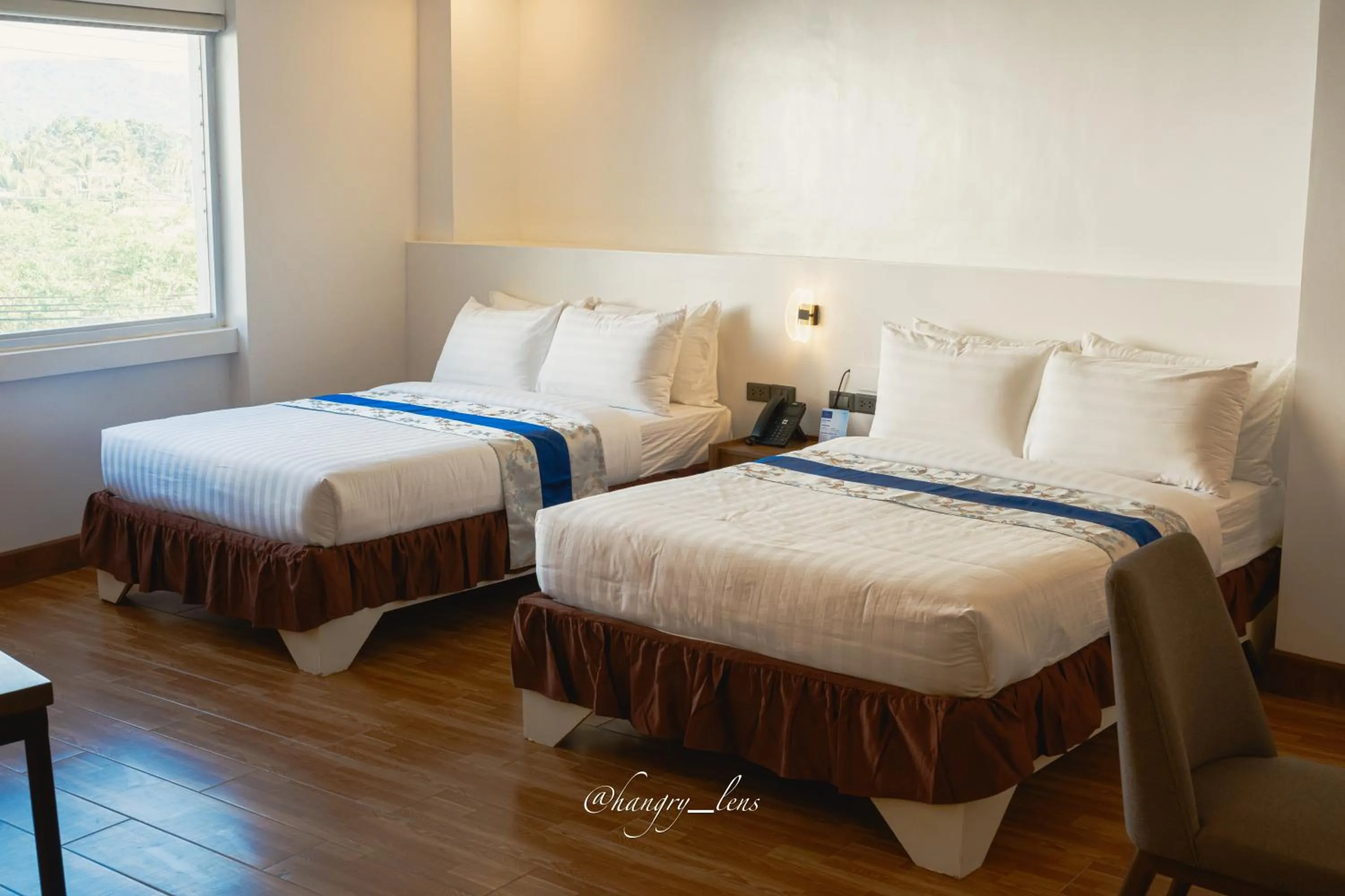 Bed in Santiago Cove Hotel and Restaurant