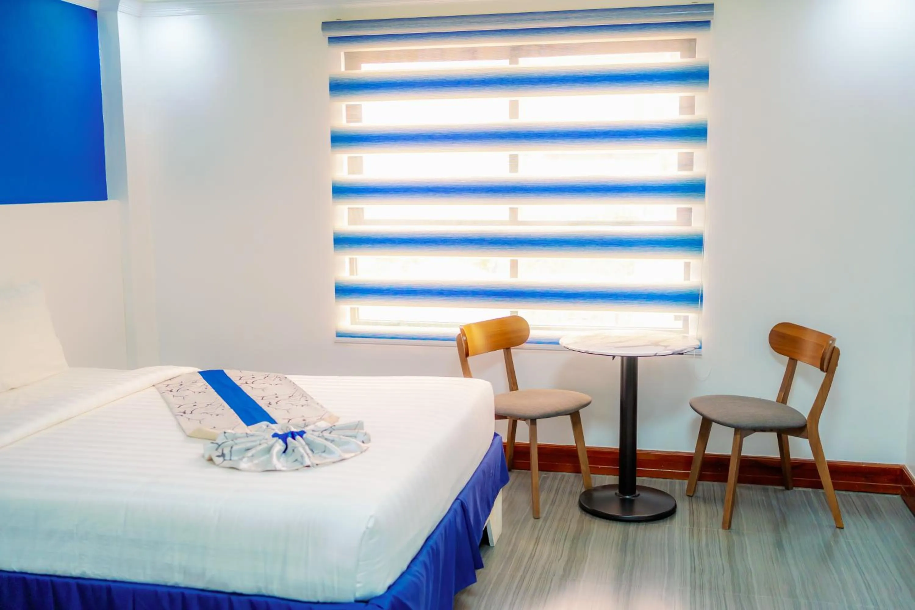 Bed in Santiago Cove Hotel and Restaurant