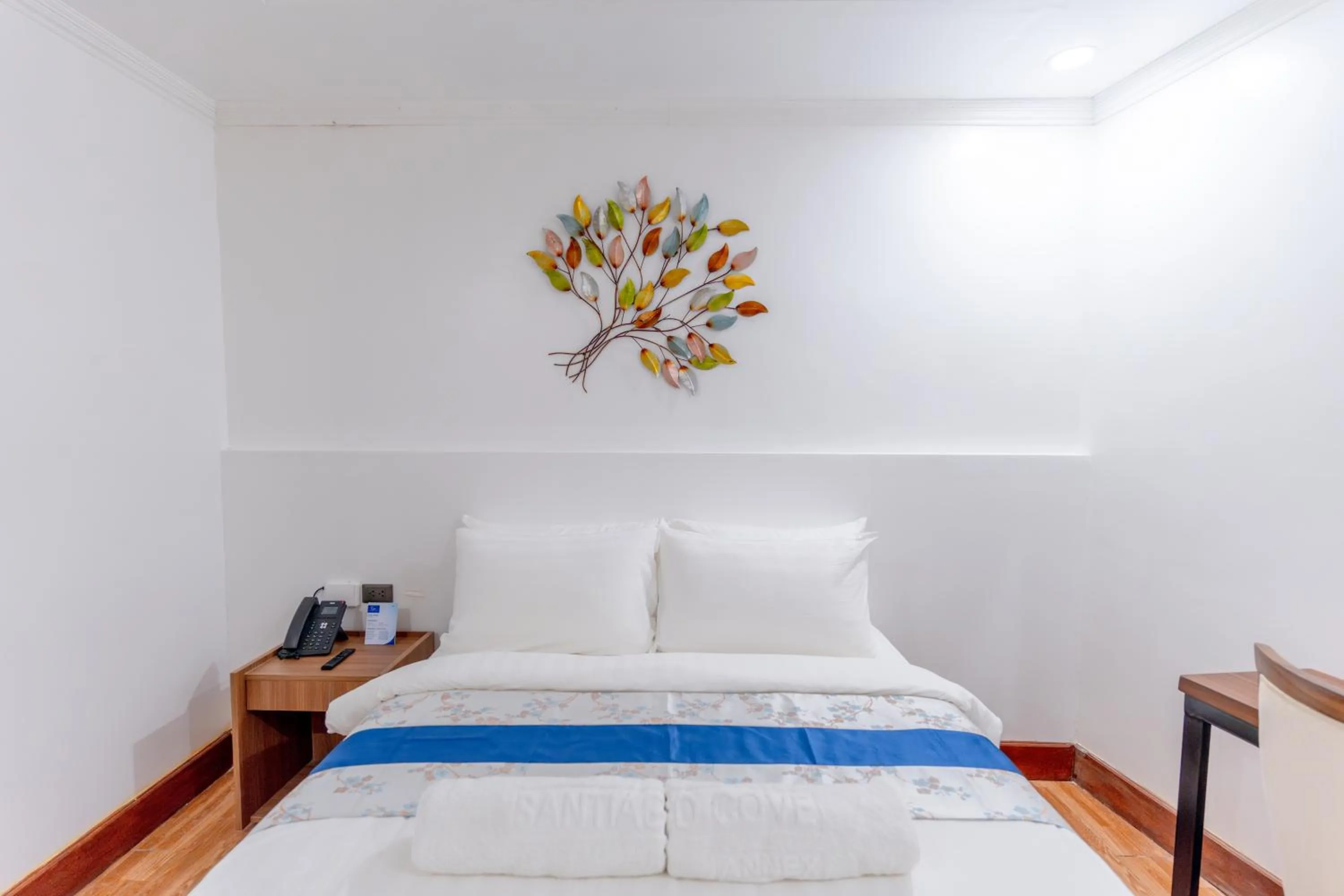 Bed in Santiago Cove Hotel and Restaurant